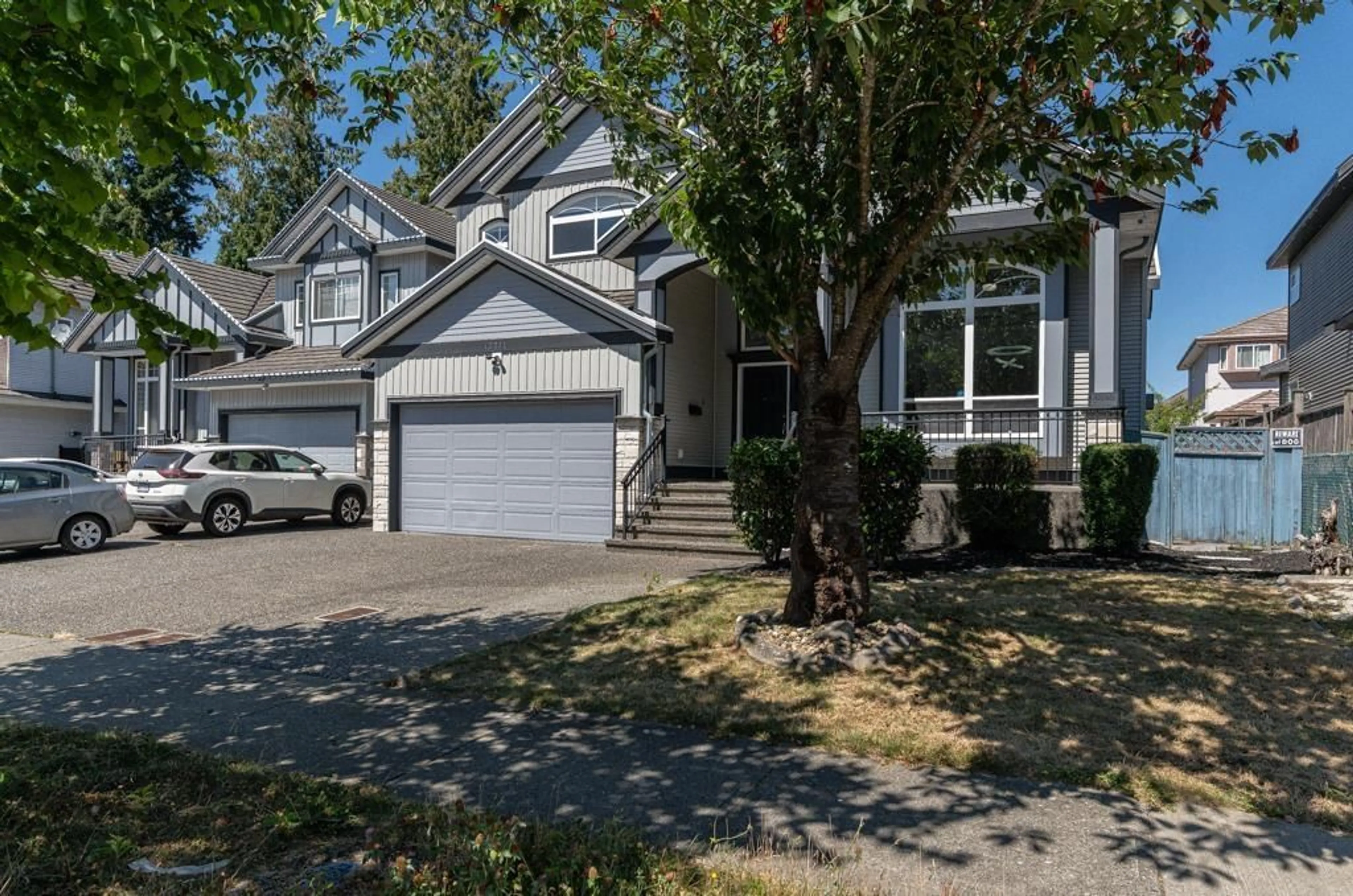 Home with vinyl exterior material, street for 12761 60A, Surrey British Columbia V3X0A1