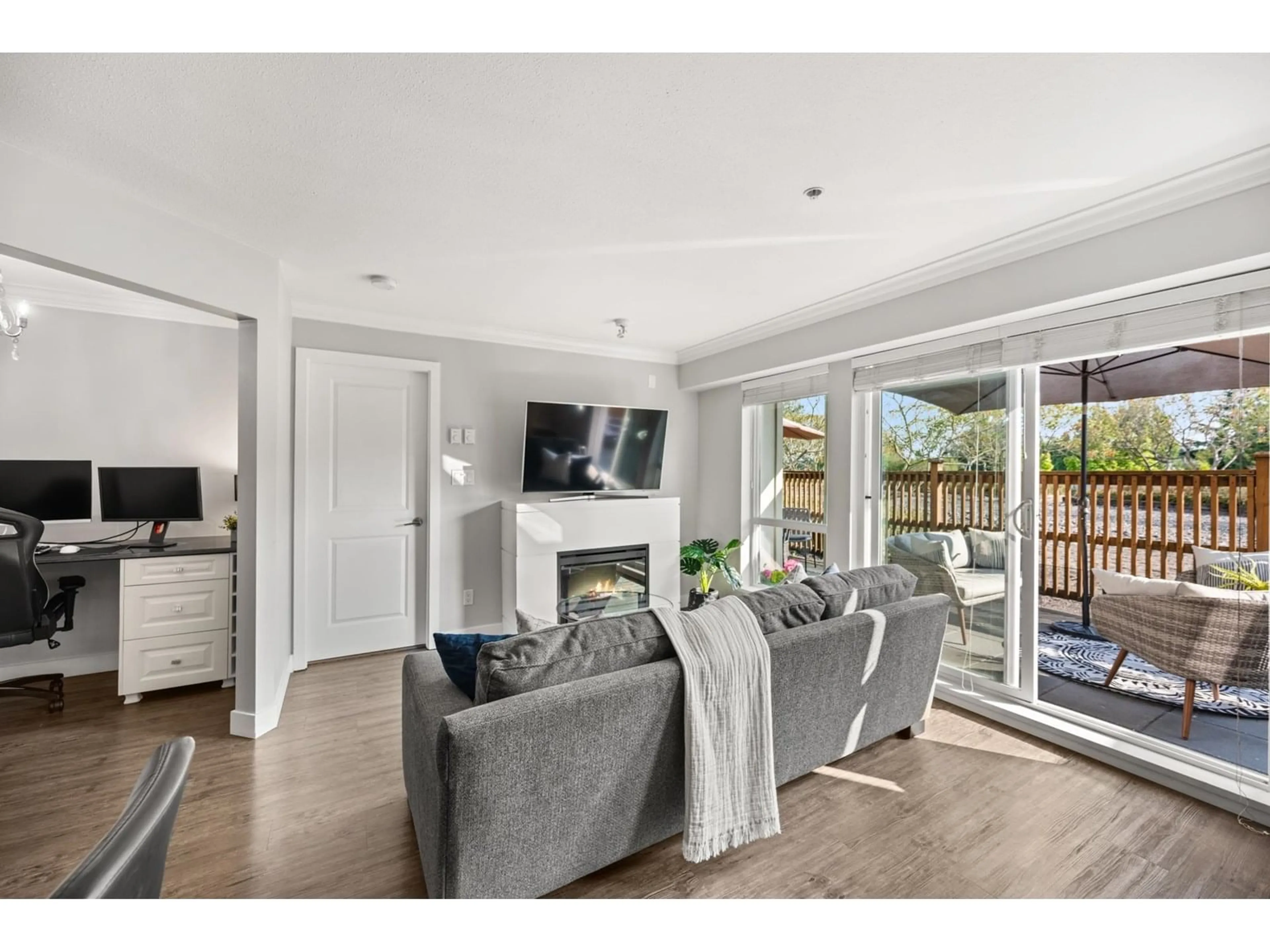 Living room with furniture, wood/laminate floor for 209 - 15735 CROYDON, Surrey British Columbia V3S2L5