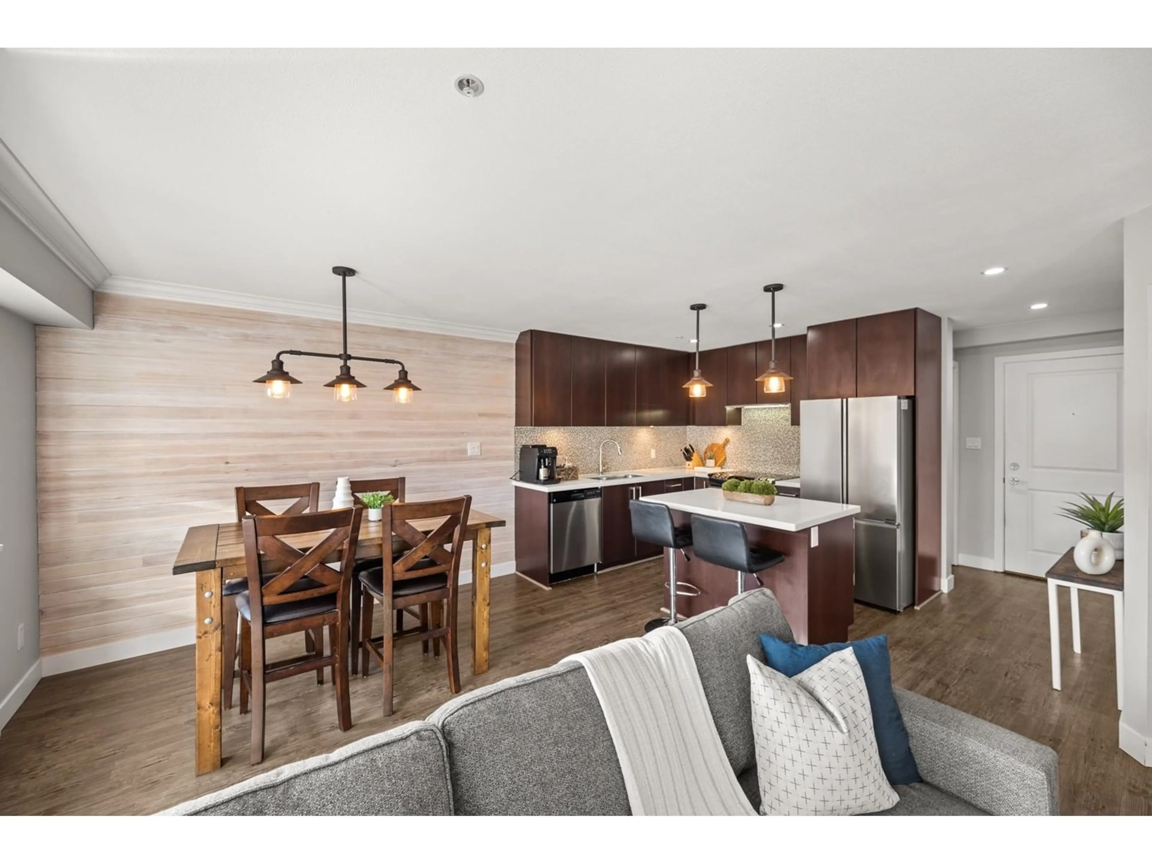 Open concept kitchen, wood/laminate floor for 209 - 15735 CROYDON, Surrey British Columbia V3S2L5