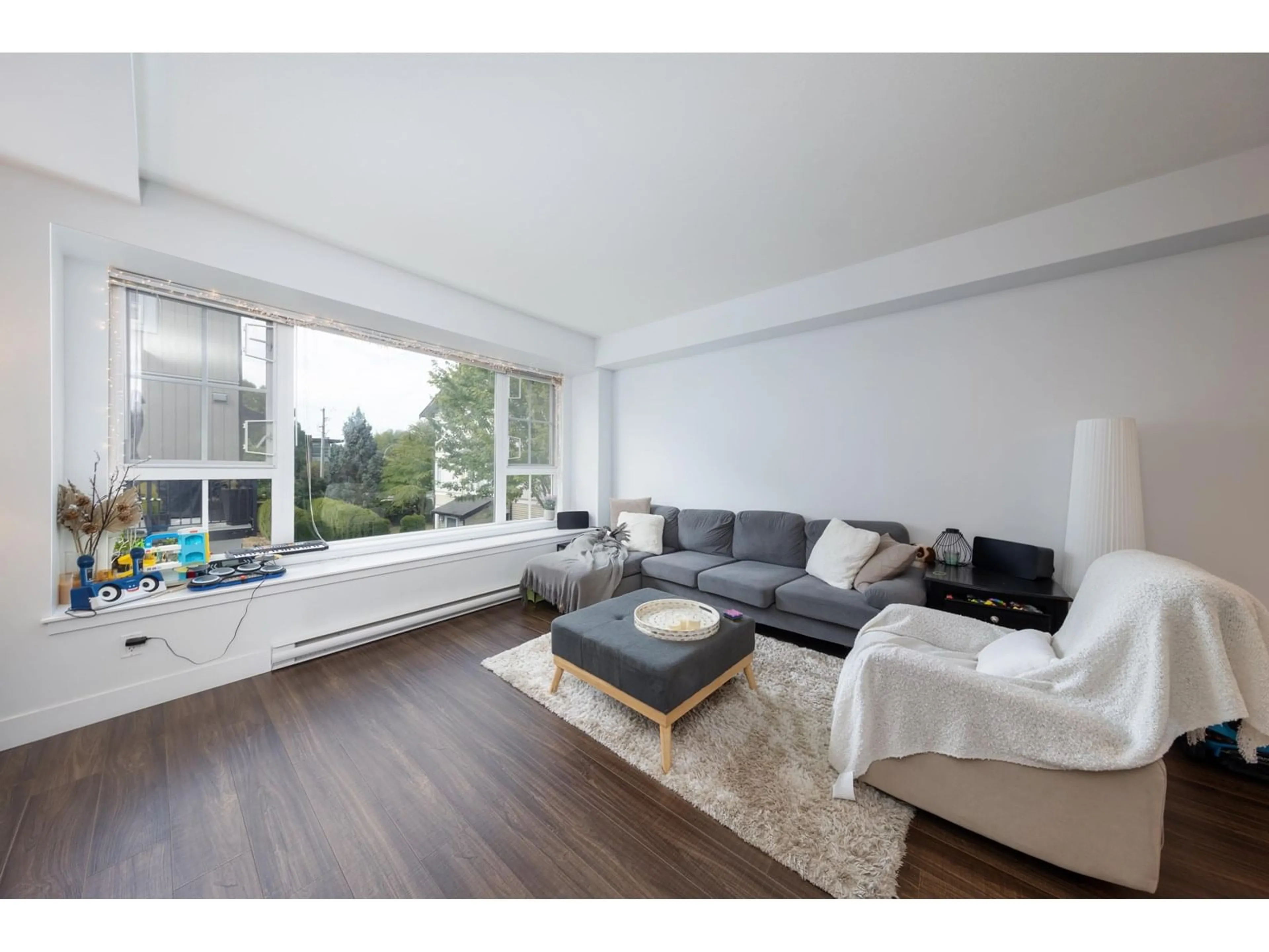 Living room with furniture, wood/laminate floor for 53 - 2450 161A, Surrey British Columbia V3Z8K4