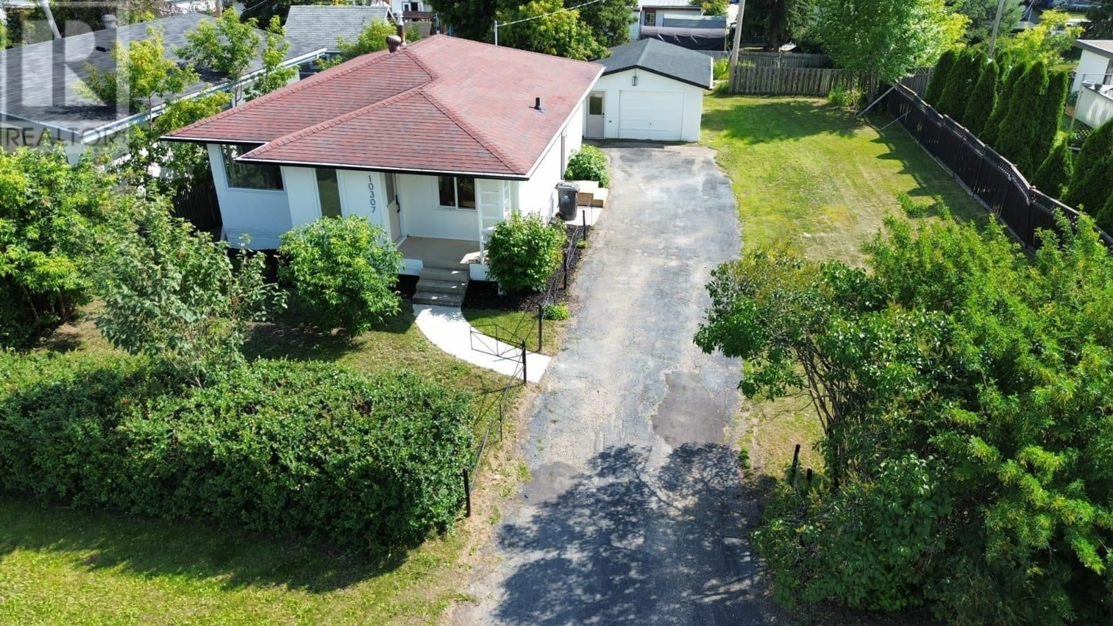 A pic from outside/outdoor area/front of a property/back of a property/a pic from drone, street for 10307 104 AVENUE, Fort St. John British Columbia V1J2K8