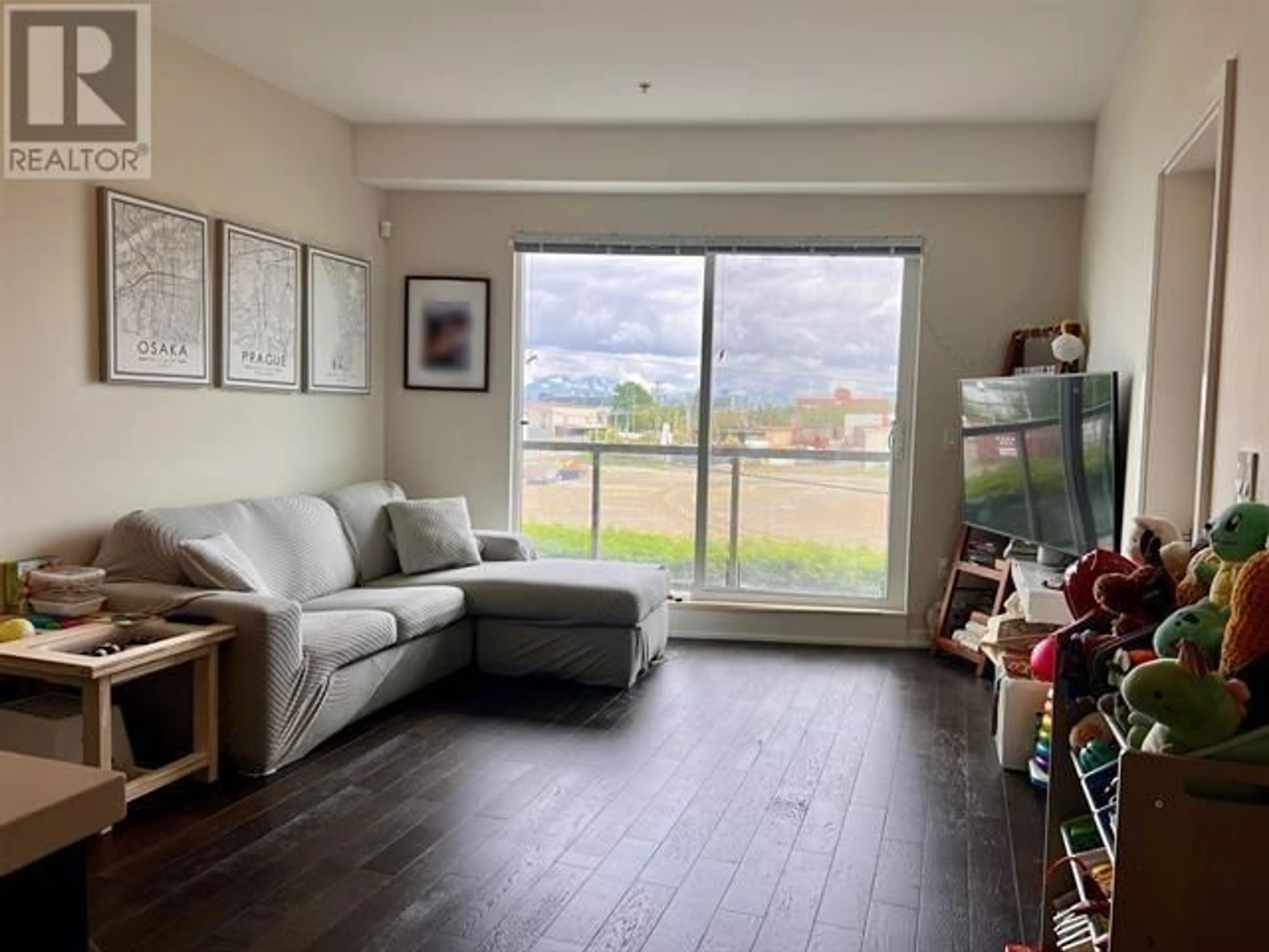 Living room with furniture, wood/laminate floor for 208 - 7008 RIVER PARKWAY, Richmond British Columbia V6X0R1
