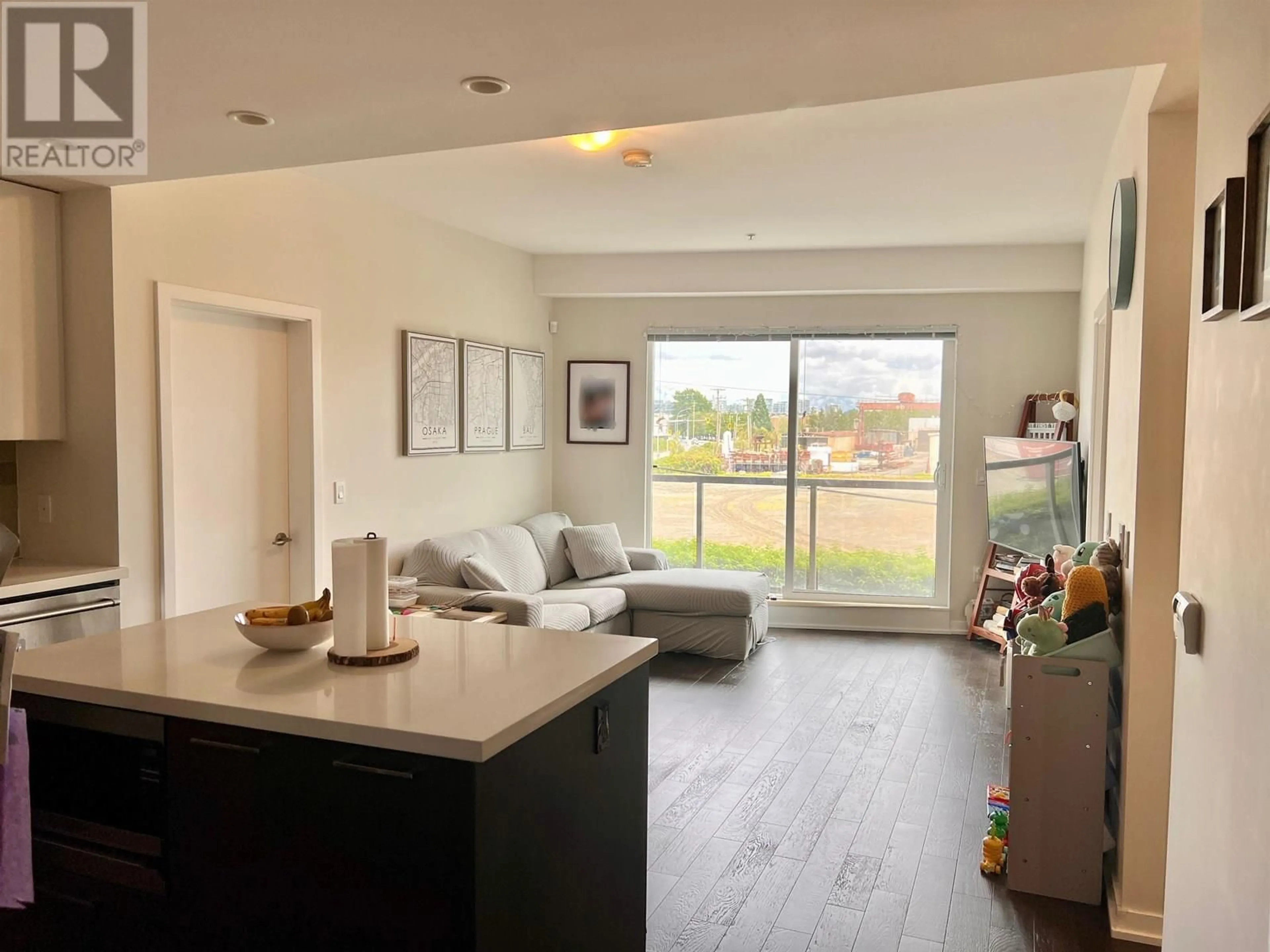 Open concept kitchen, wood/laminate floor for 208 - 7008 RIVER PARKWAY, Richmond British Columbia V6X0R1