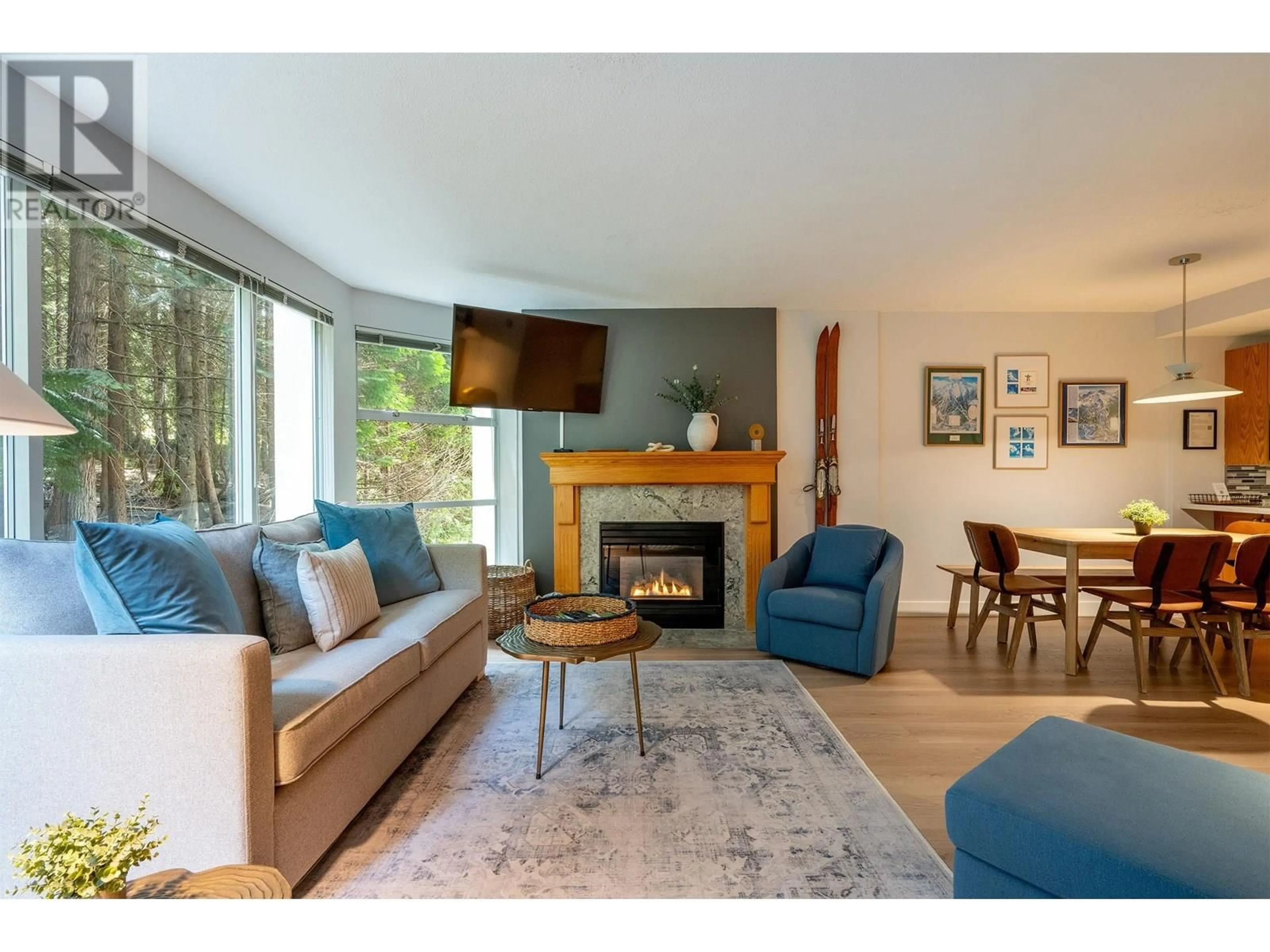 Living room with furniture, wood/laminate floor for 312 - 4910 SPEARHEAD PLACE, Whistler British Columbia V8E1G1