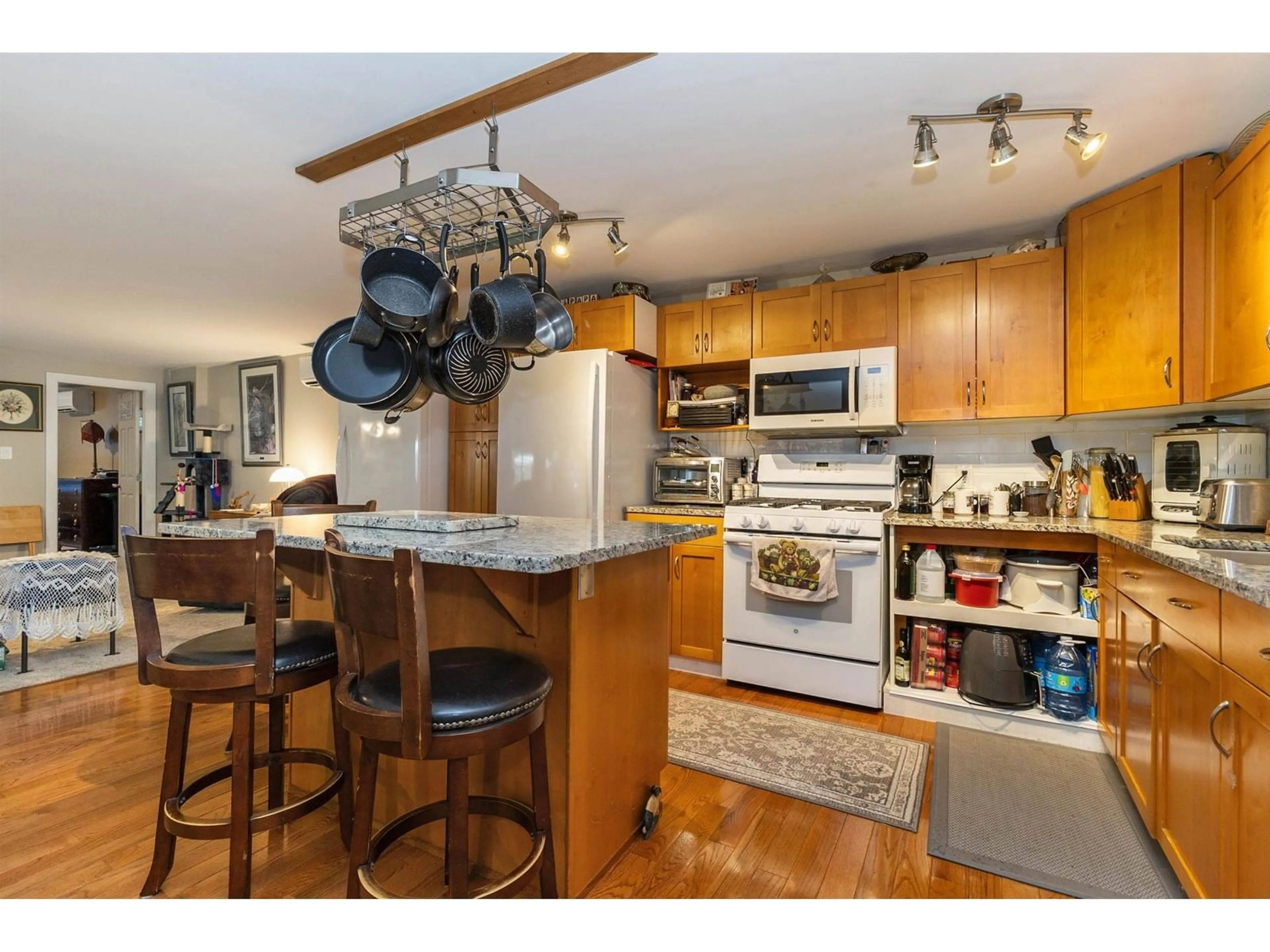 Open concept kitchen, wood/laminate floor for 107 - 46511 CHILLIWACK LAKE ROAD, Sardis - Chwk River Valley British Columbia V2R3S4