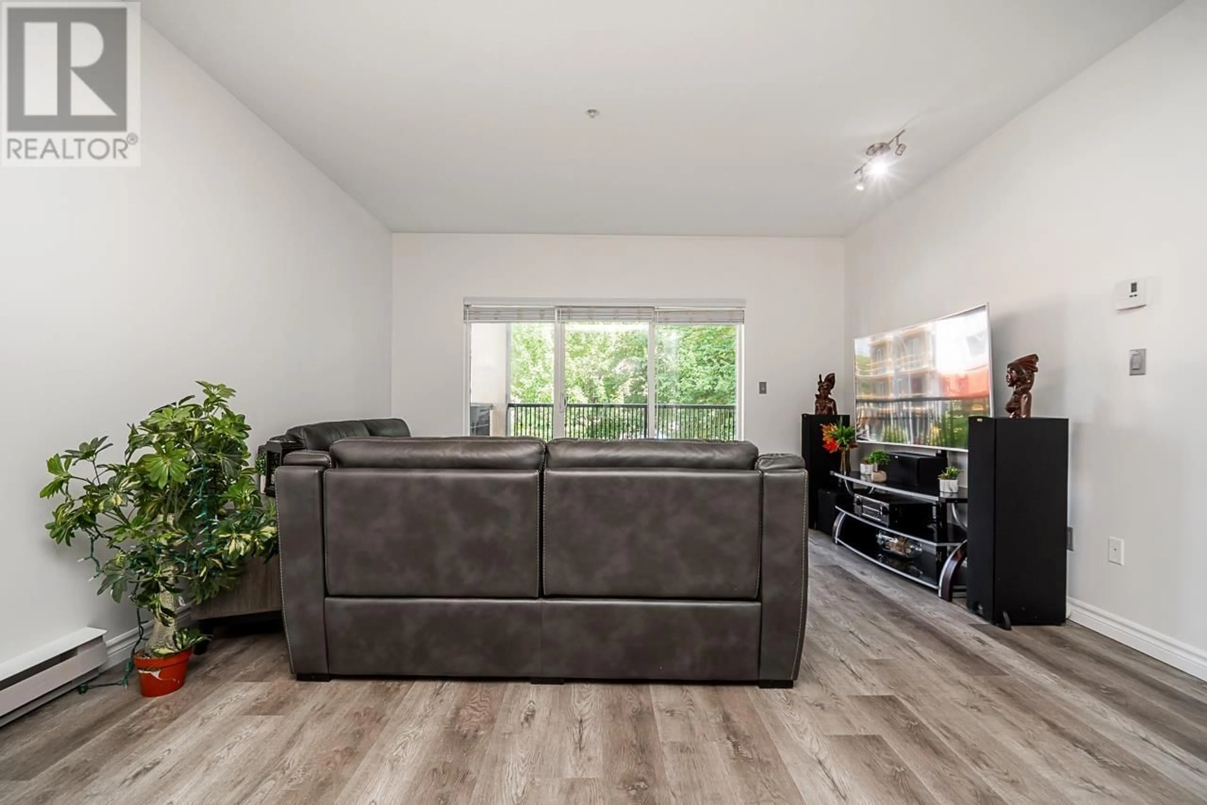 Living room with furniture, wood/laminate floor for 213 - 2478 WELCHER AVENUE, Port Coquitlam British Columbia V3C0A6