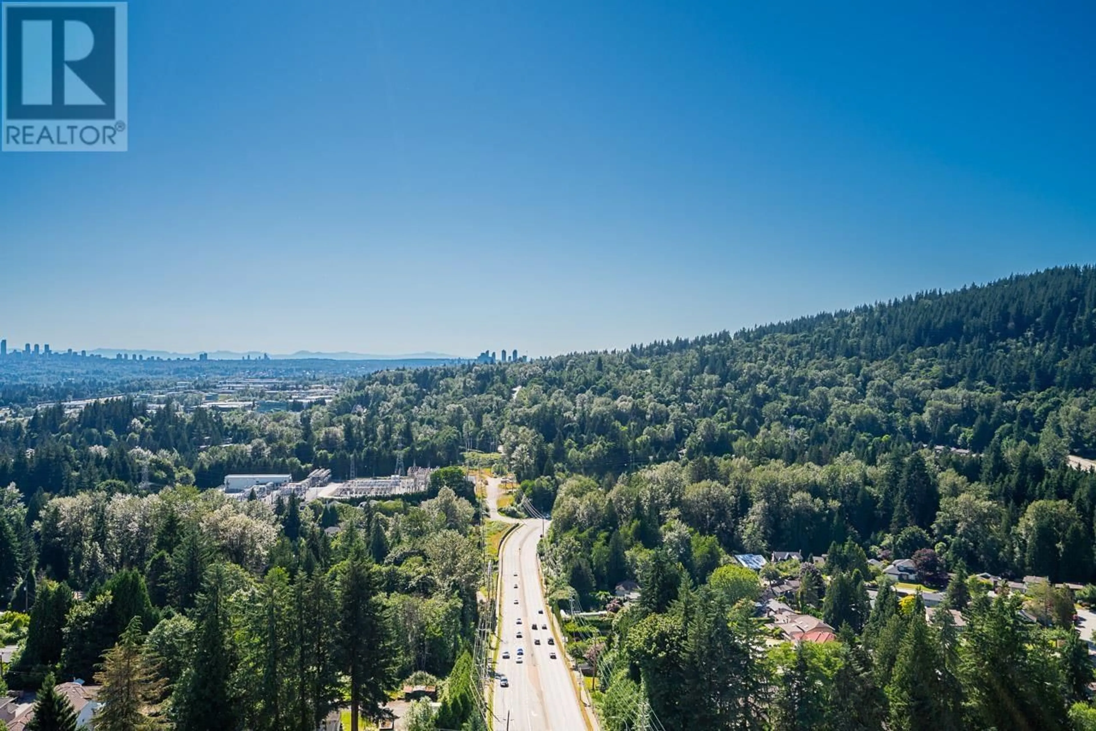 A pic from outside/outdoor area/front of a property/back of a property/a pic from drone, mountain view for 2603 - 520 COMO LAKE AVENUE, Coquitlam British Columbia V3J0E8