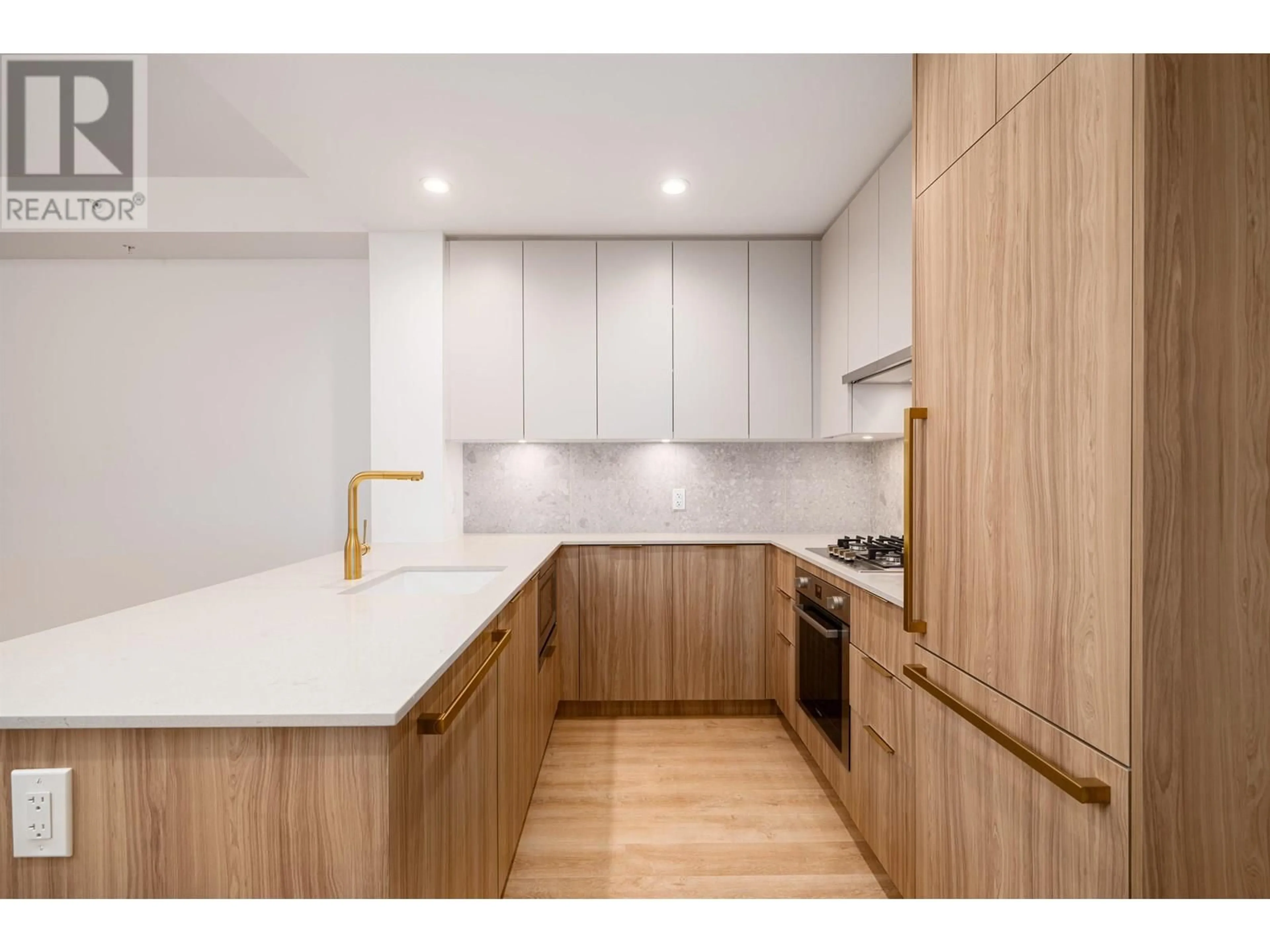 Open concept kitchen, wood/laminate floor for 202 - 2325 EMERY COURT, North Vancouver British Columbia V7J0E8