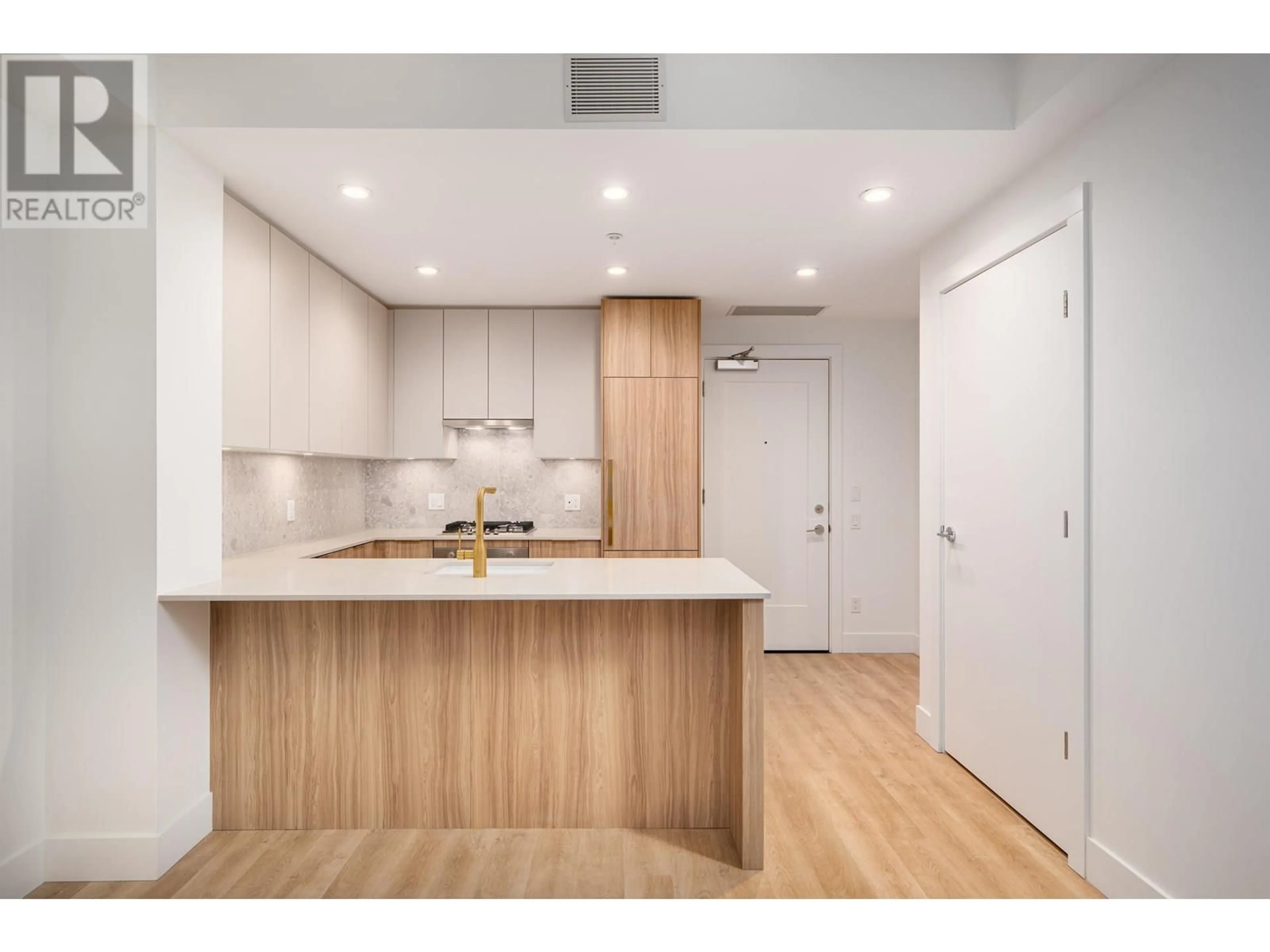 Open concept kitchen, wood/laminate floor for 202 - 2325 EMERY COURT, North Vancouver British Columbia V7J0E8
