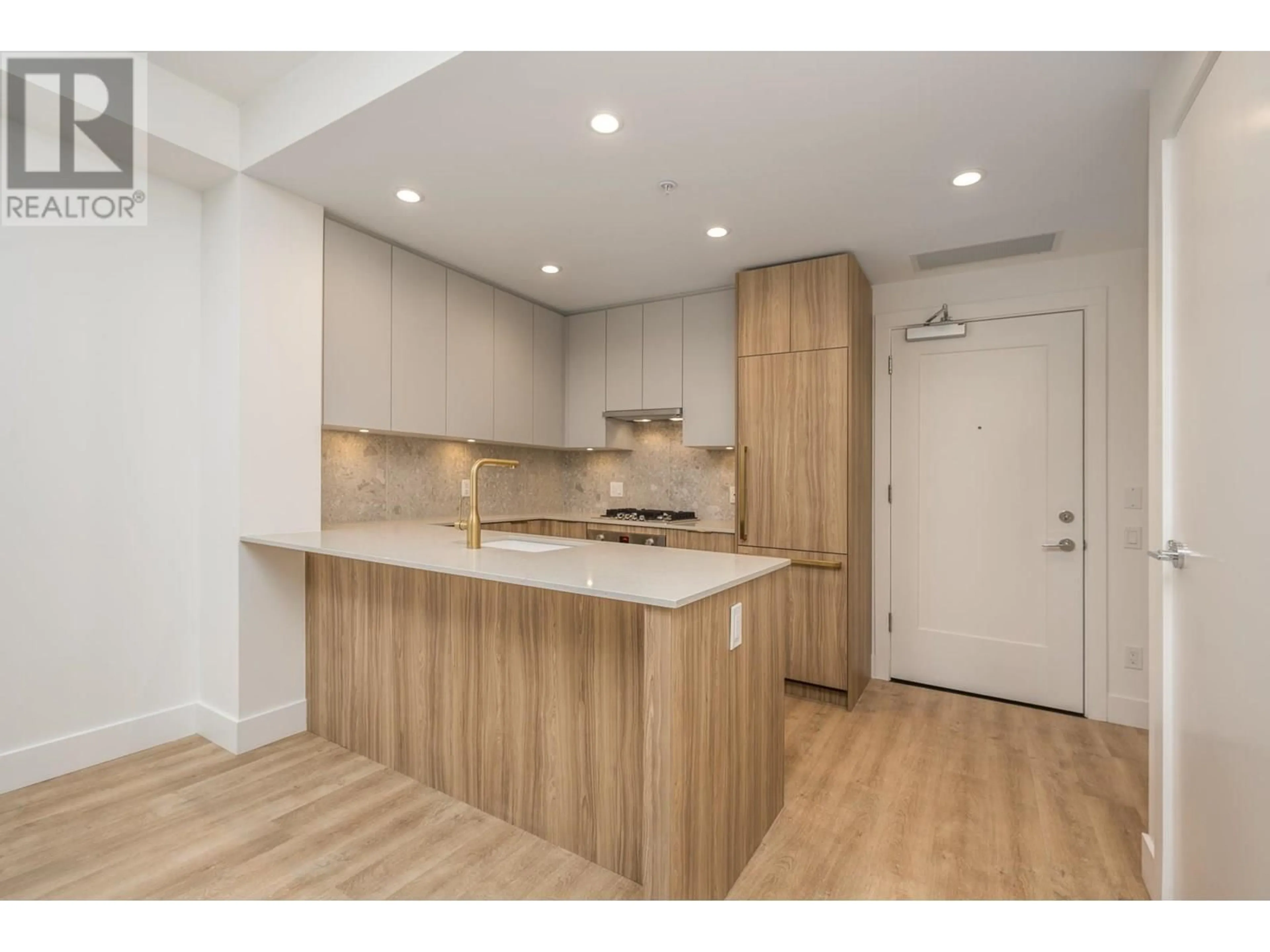 Open concept kitchen, wood/laminate floor for 202 - 2325 EMERY COURT, North Vancouver British Columbia V7J0E8