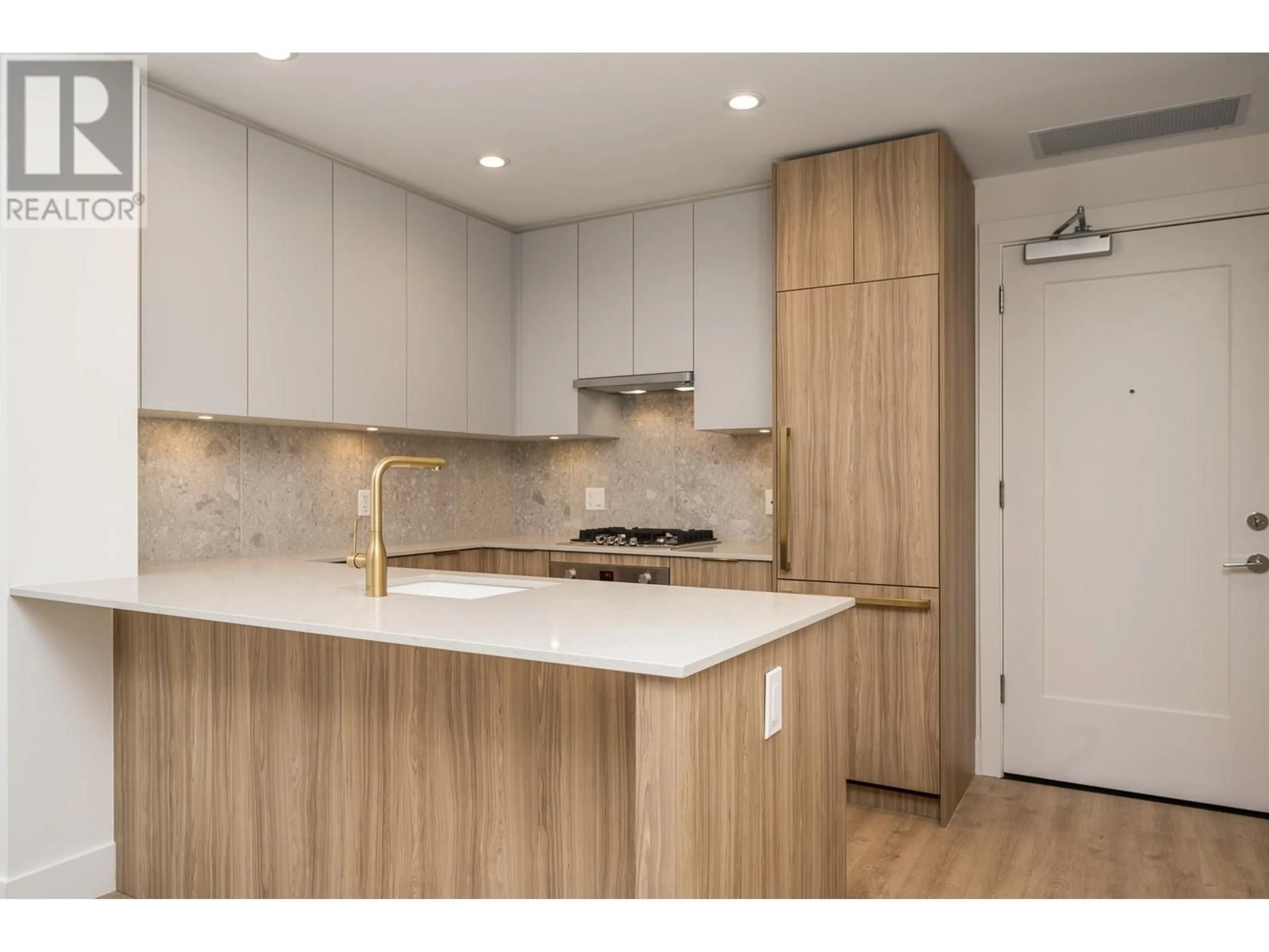 Open concept kitchen, wood/laminate floor for 202 - 2325 EMERY COURT, North Vancouver British Columbia V7J0E8