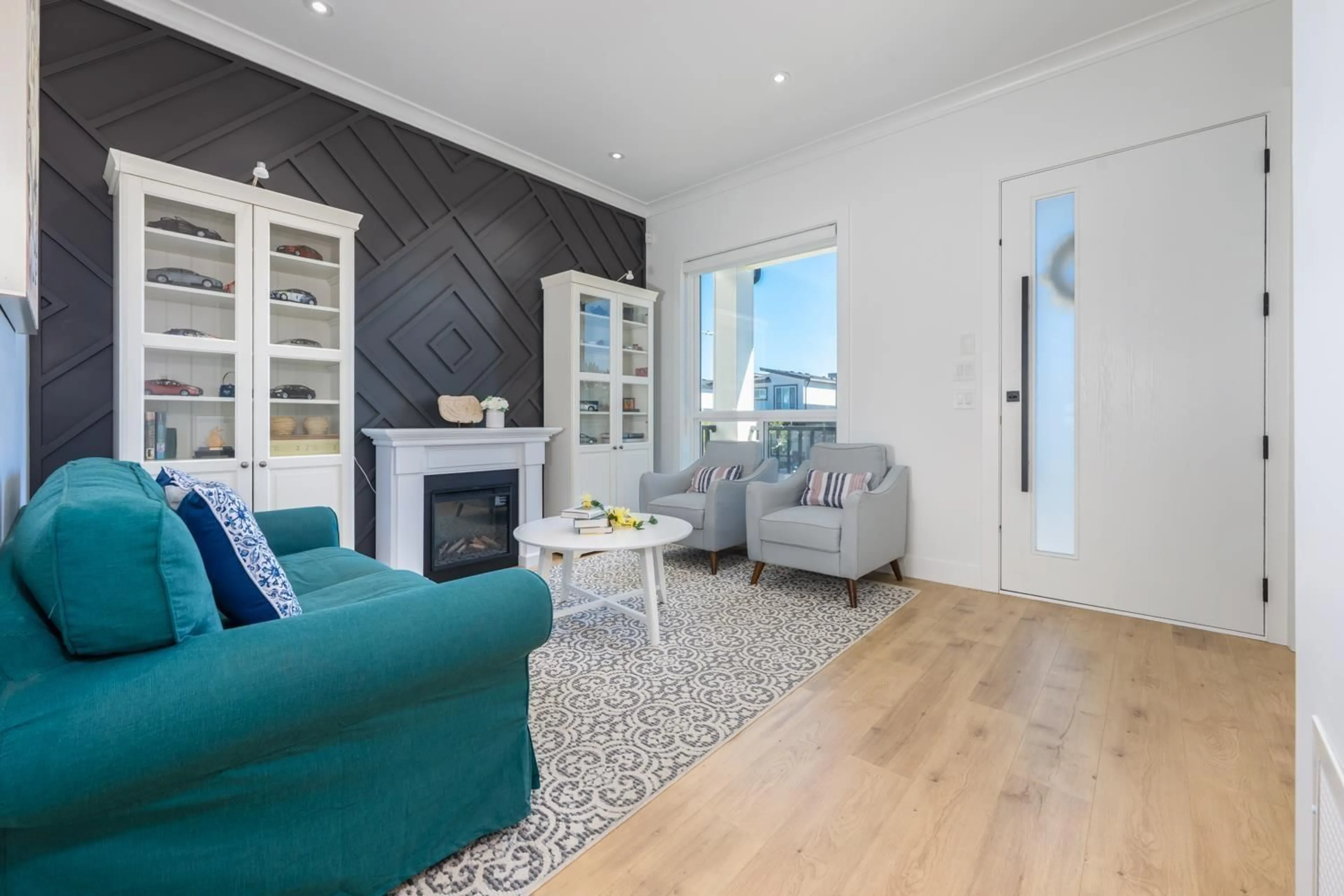 Living room with furniture, wood/laminate floor for 16733 15A, Surrey British Columbia V3S9X7