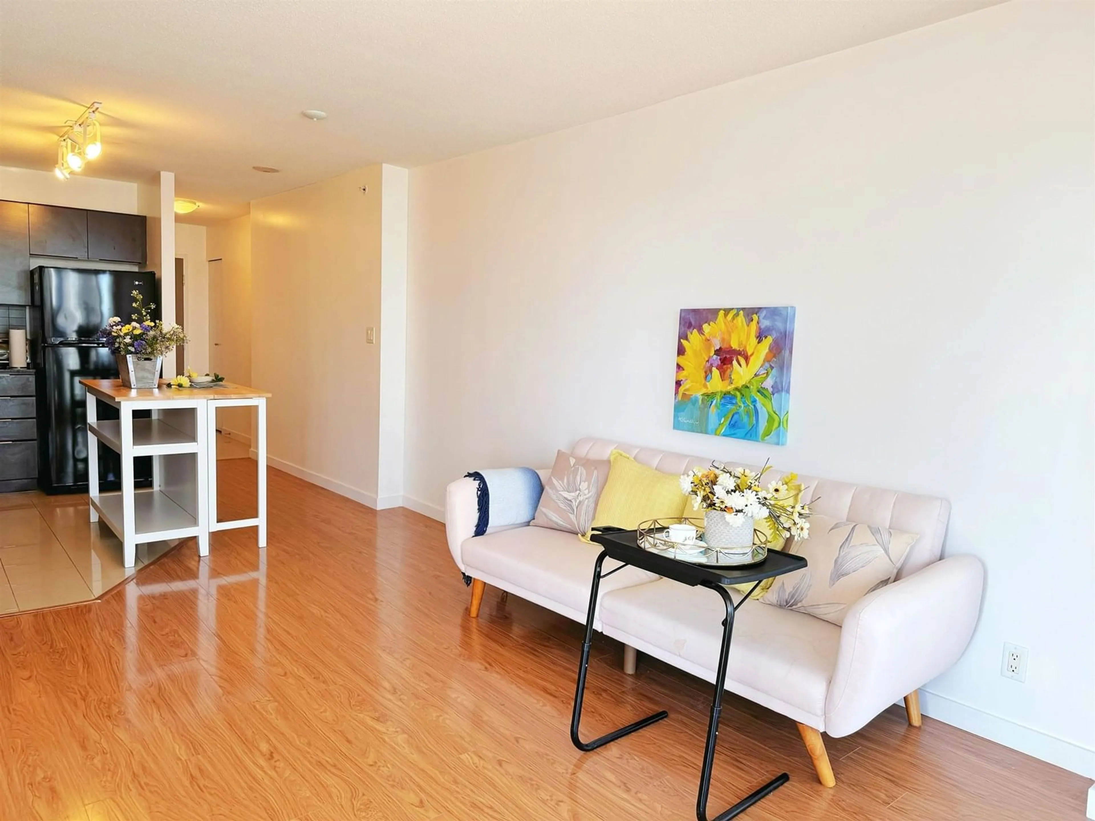 Living room with furniture, wood/laminate floor for 1009 - 13618 100, Surrey British Columbia V3T0A8