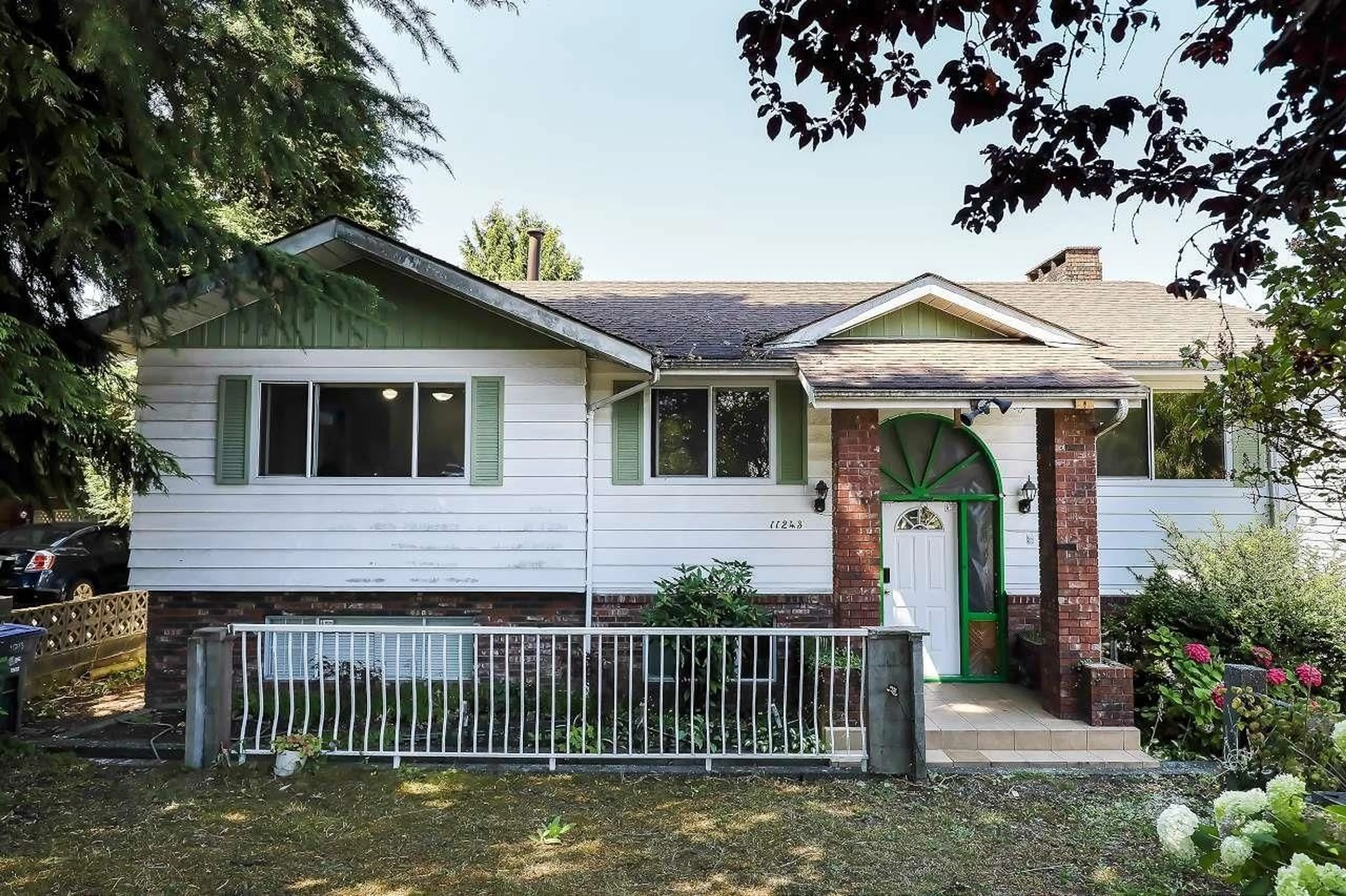 Home with vinyl exterior material, street for 11243 136, Surrey British Columbia V3R3B8