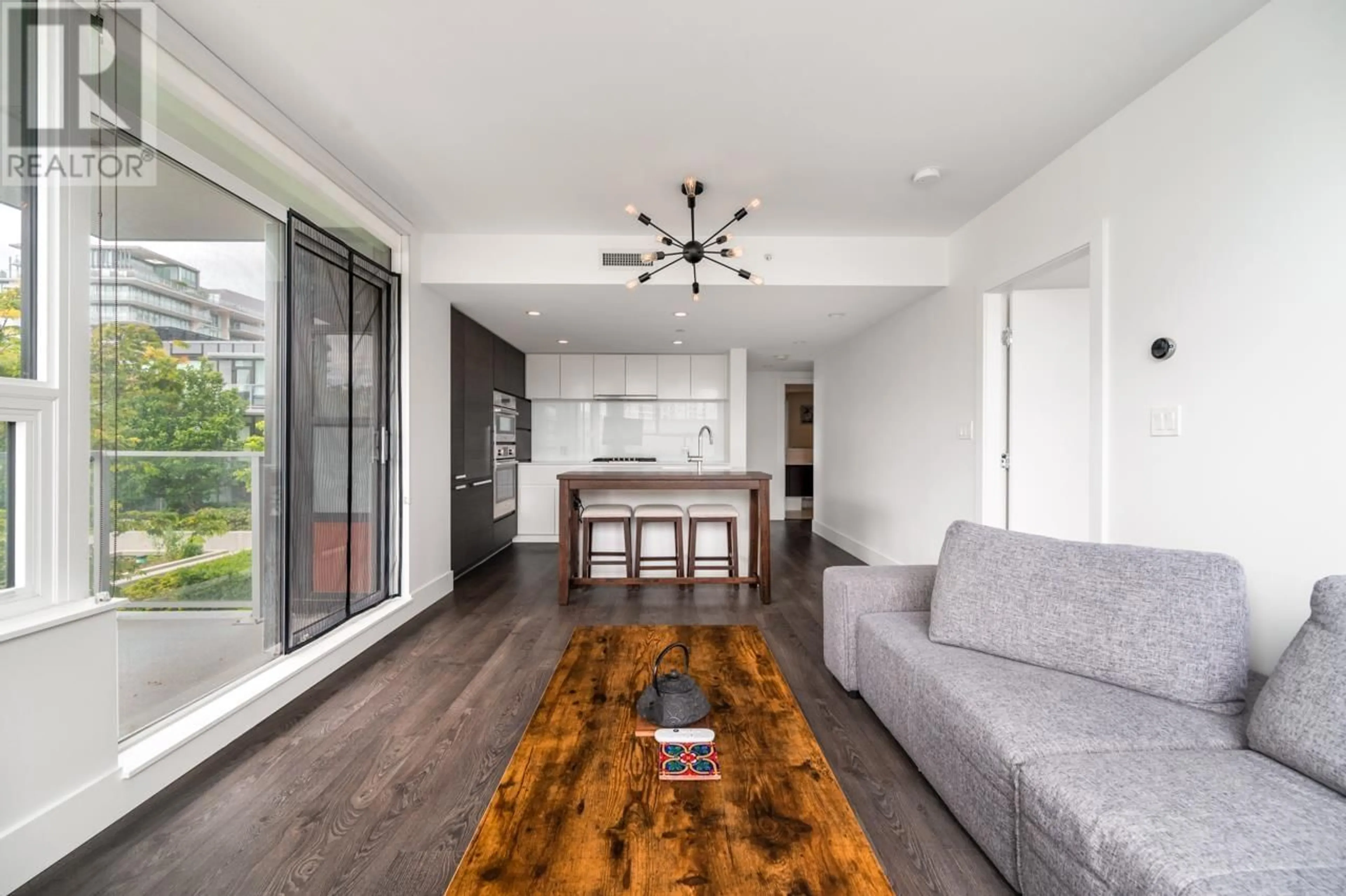 Living room with furniture, wood/laminate floor for 503 - 6900 PEARSON WAY, Richmond British Columbia V7C0C9