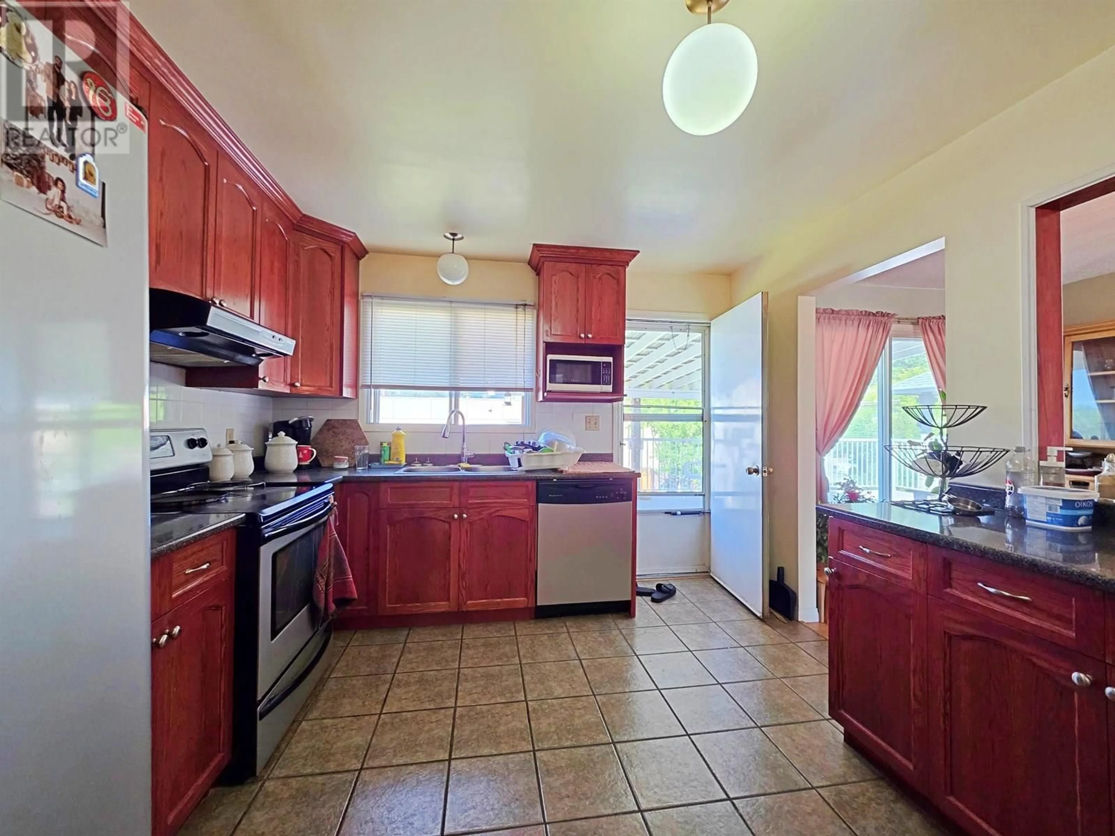 Standard kitchen, ceramic/tile floor for 677 REID STREET, Quesnel British Columbia V2J2N2