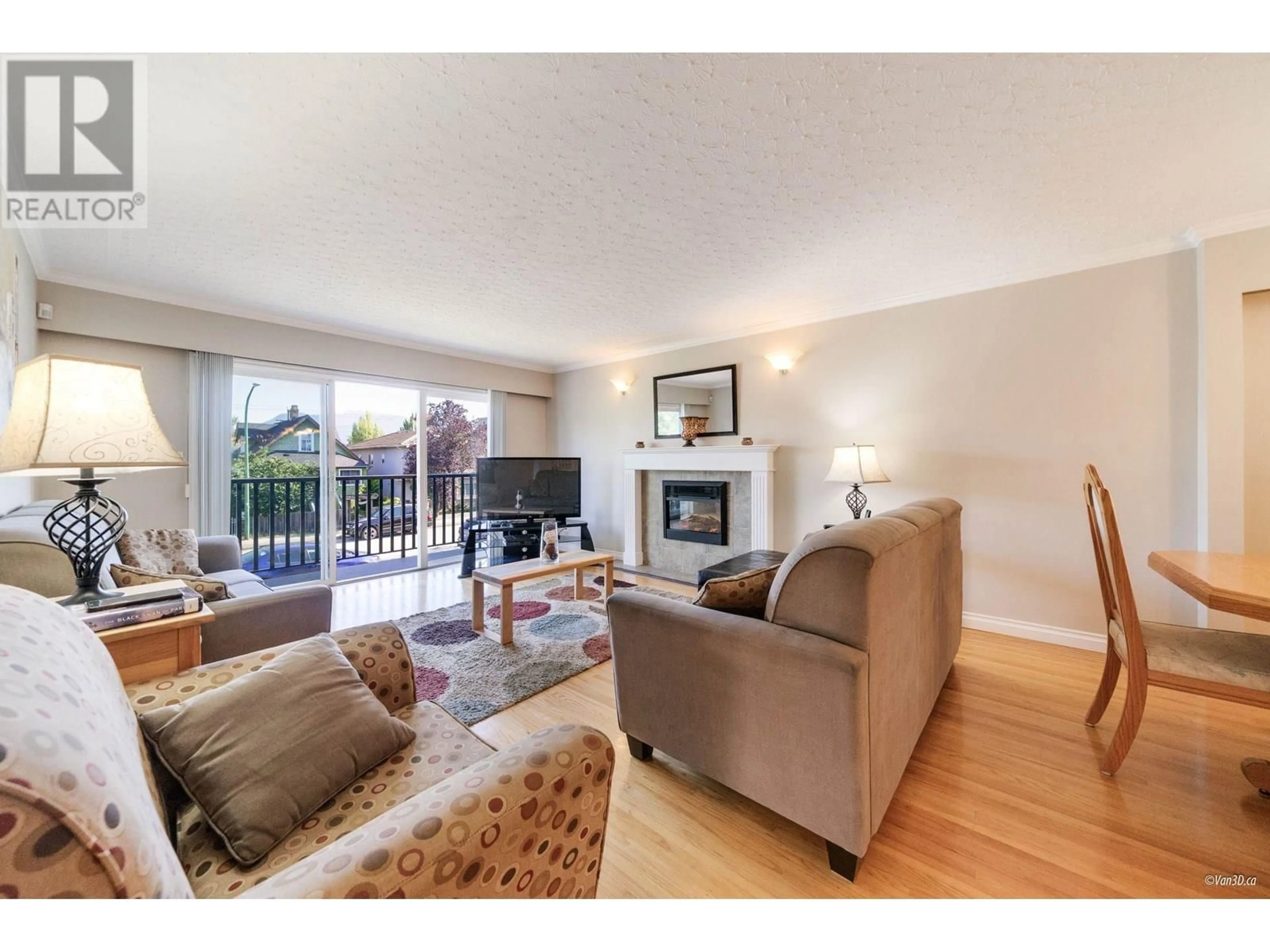 Living room with furniture, wood/laminate floor for 4524 PENDER STREET, Burnaby British Columbia V5C2N1