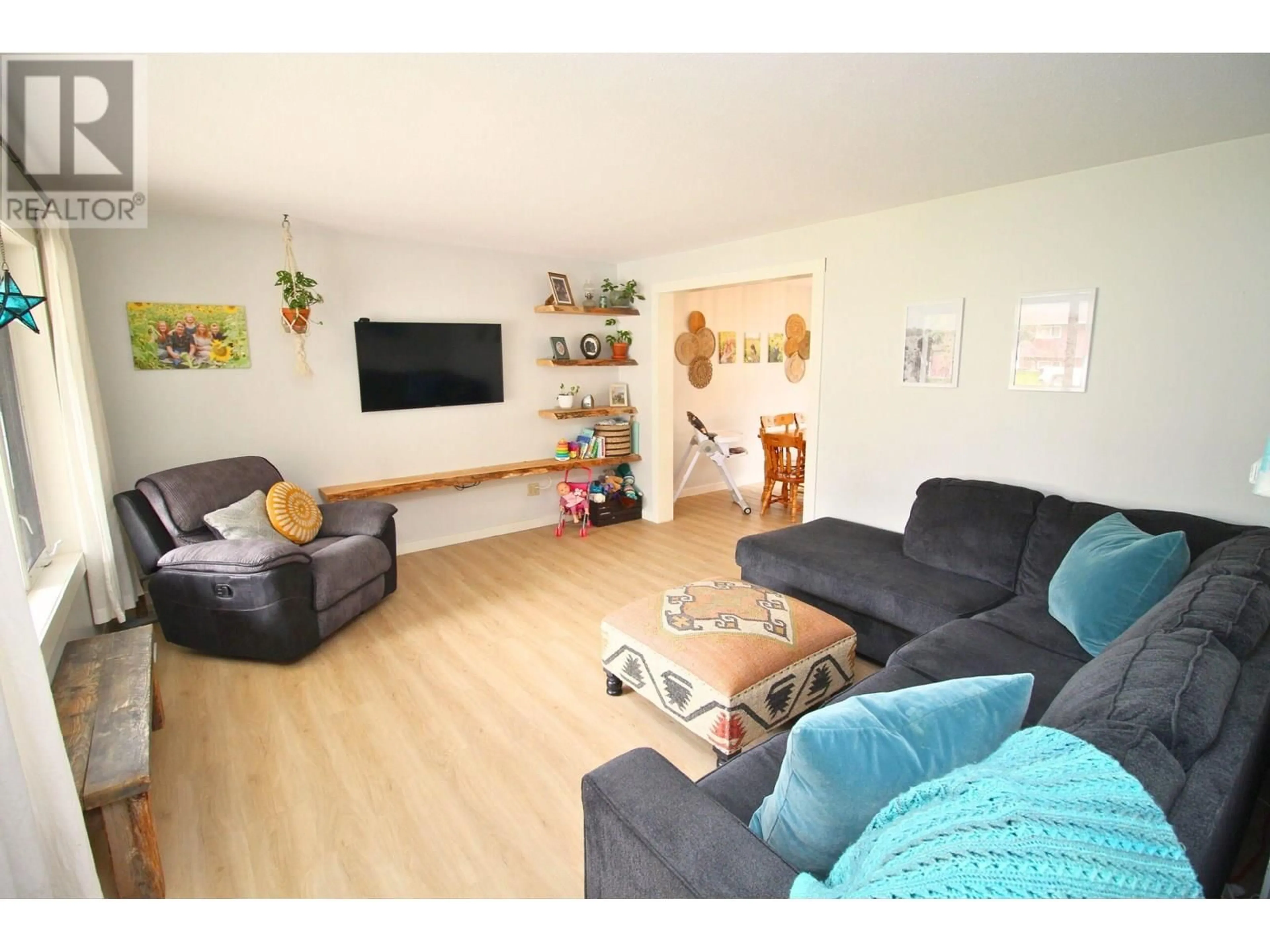 Living room with furniture, wood/laminate floor for 3780 BAGGERMAN CRESCENT, Houston British Columbia V0J1Z2