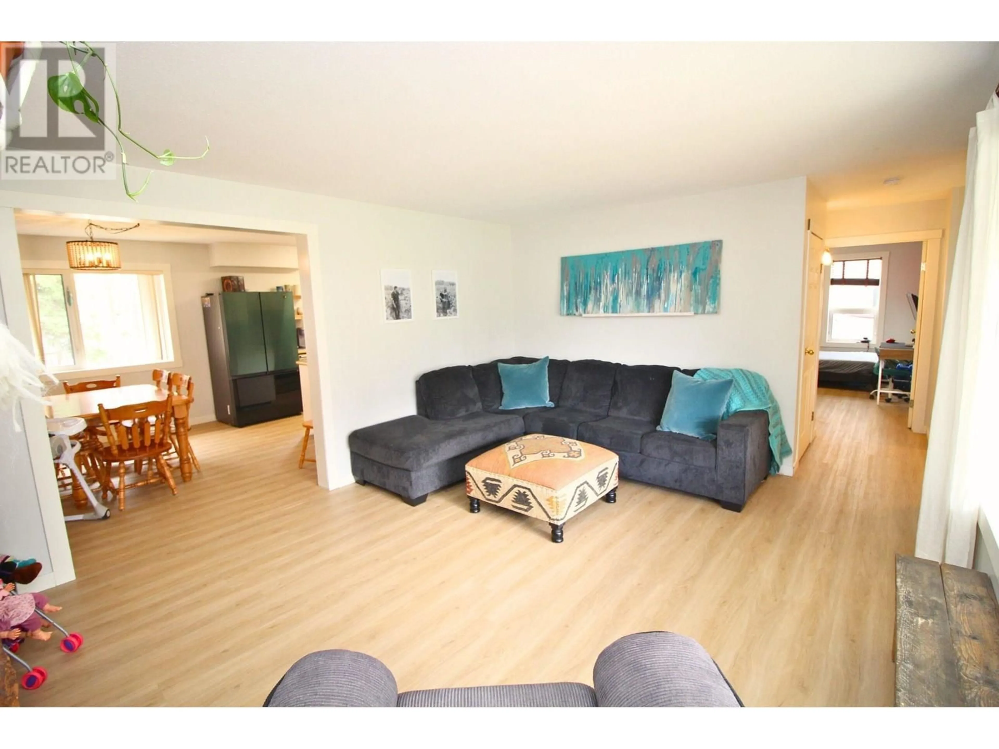 Living room with furniture, wood/laminate floor for 3780 BAGGERMAN CRESCENT, Houston British Columbia V0J1Z2