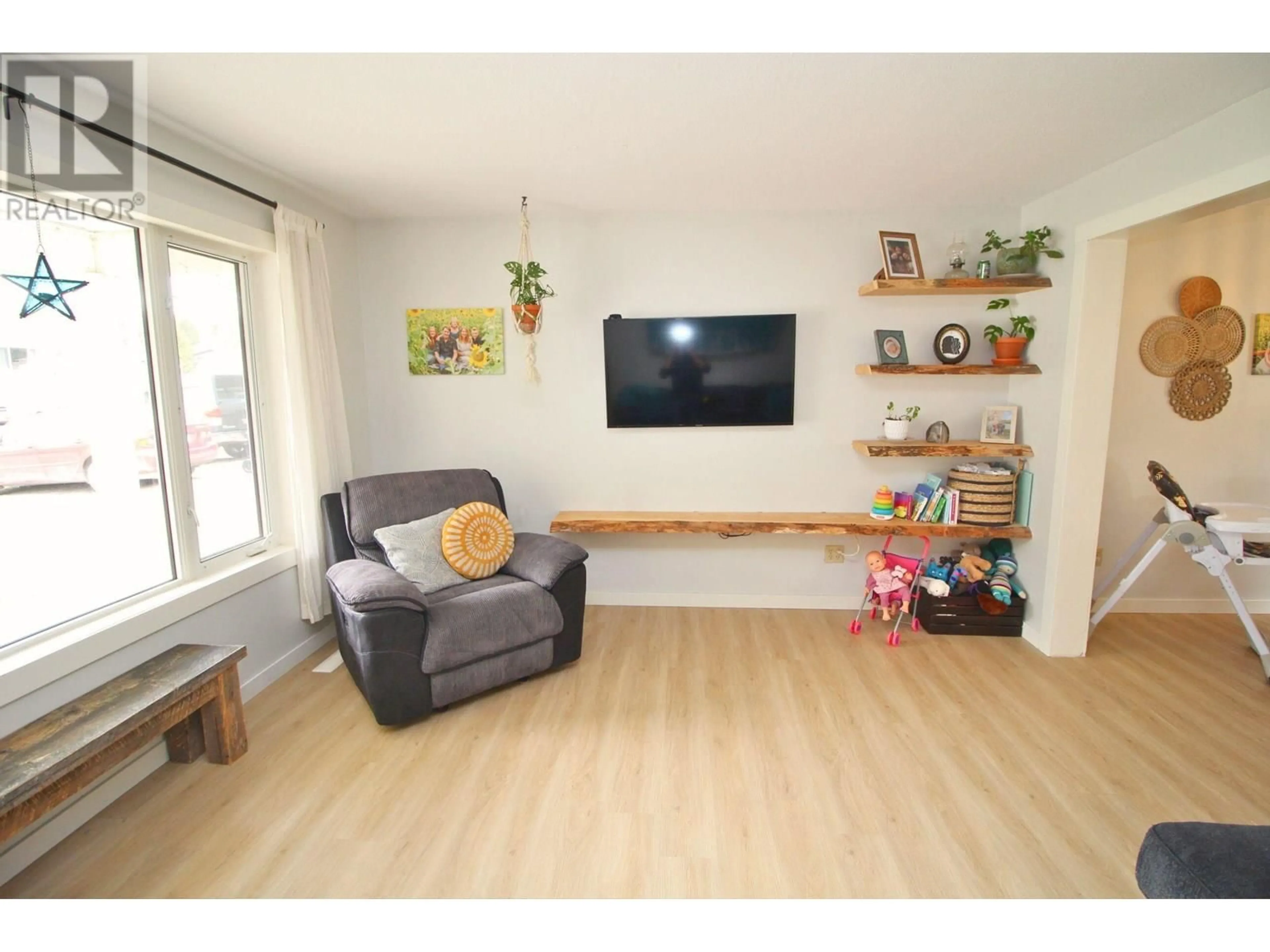 Living room with furniture, wood/laminate floor for 3780 BAGGERMAN CRESCENT, Houston British Columbia V0J1Z2