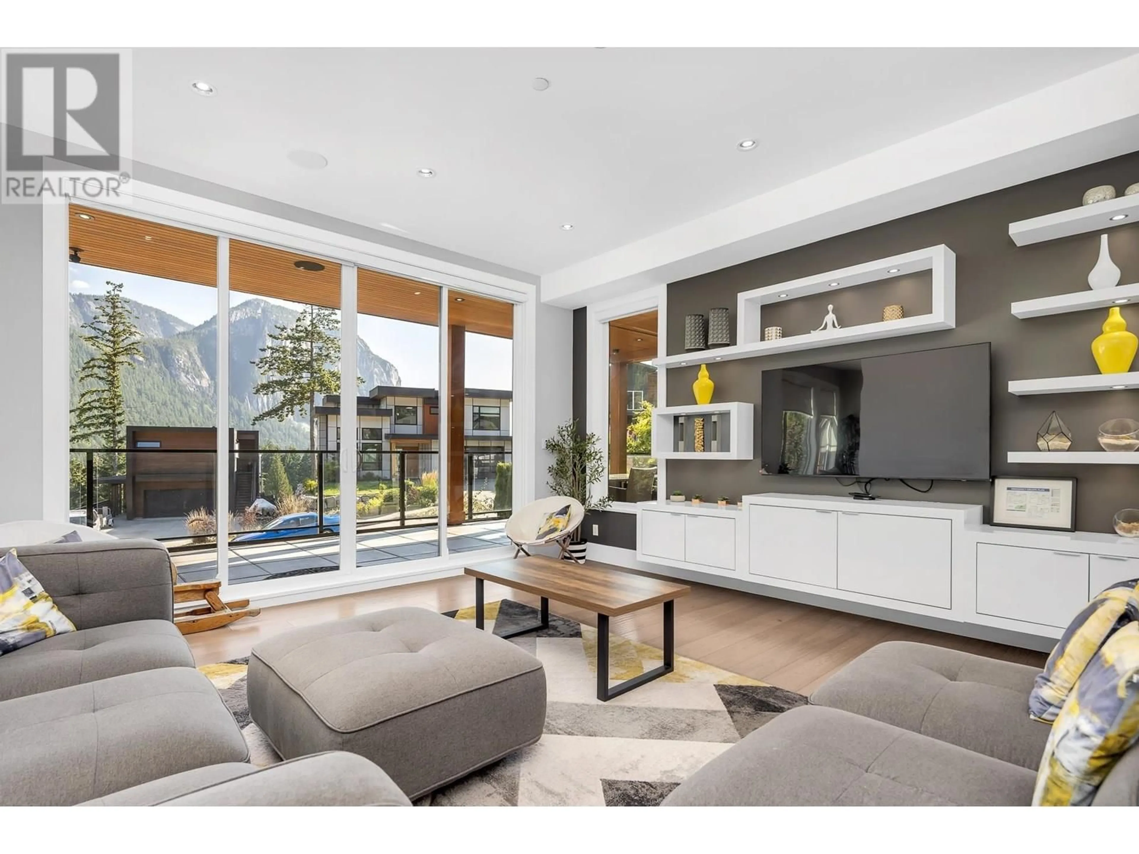 Living room with furniture, wood/laminate floor for 2213 WINDSAIL PLACE, Squamish British Columbia V8B0T6