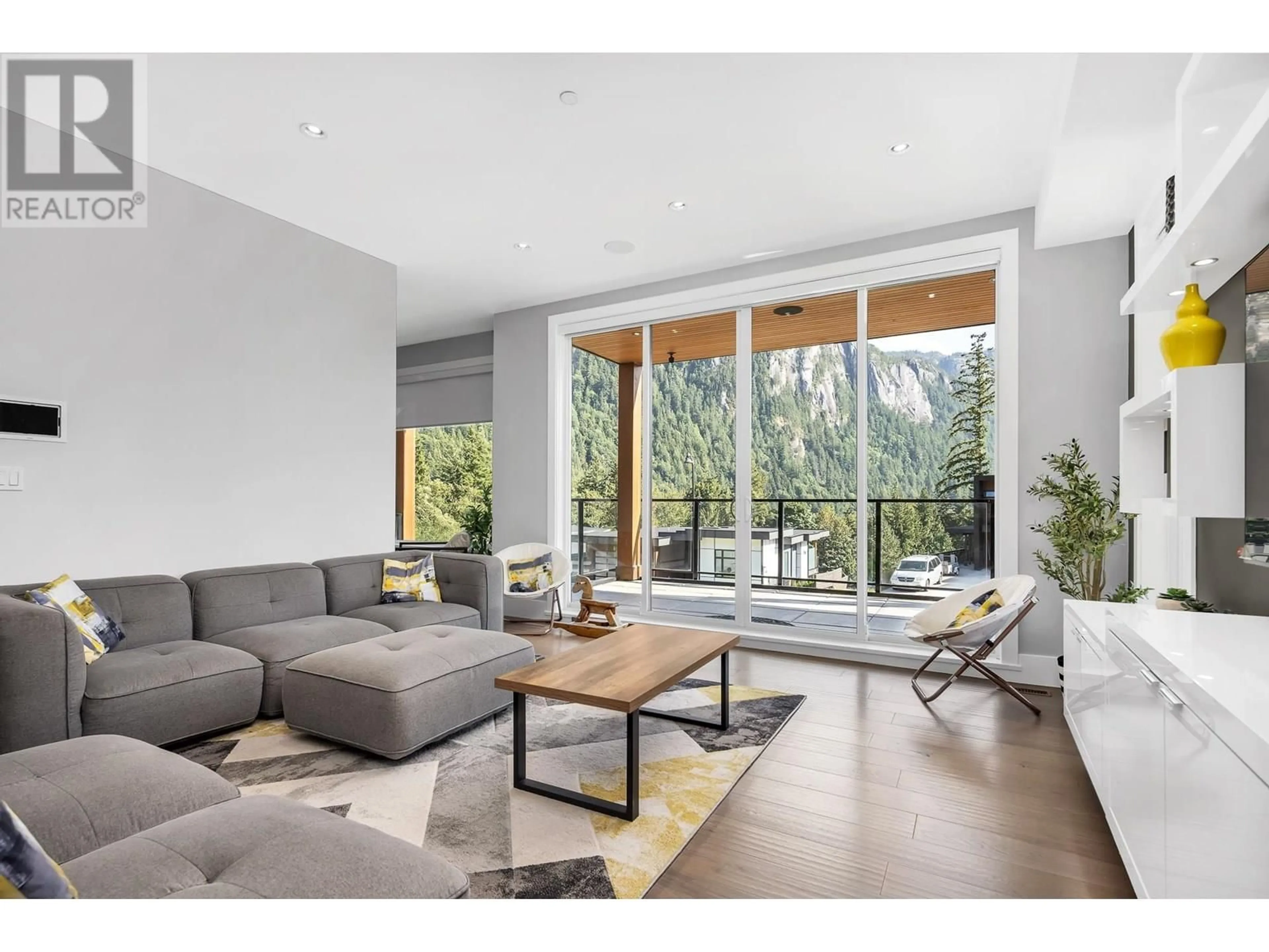 Living room with furniture, wood/laminate floor for 2213 WINDSAIL PLACE, Squamish British Columbia V8B0T6