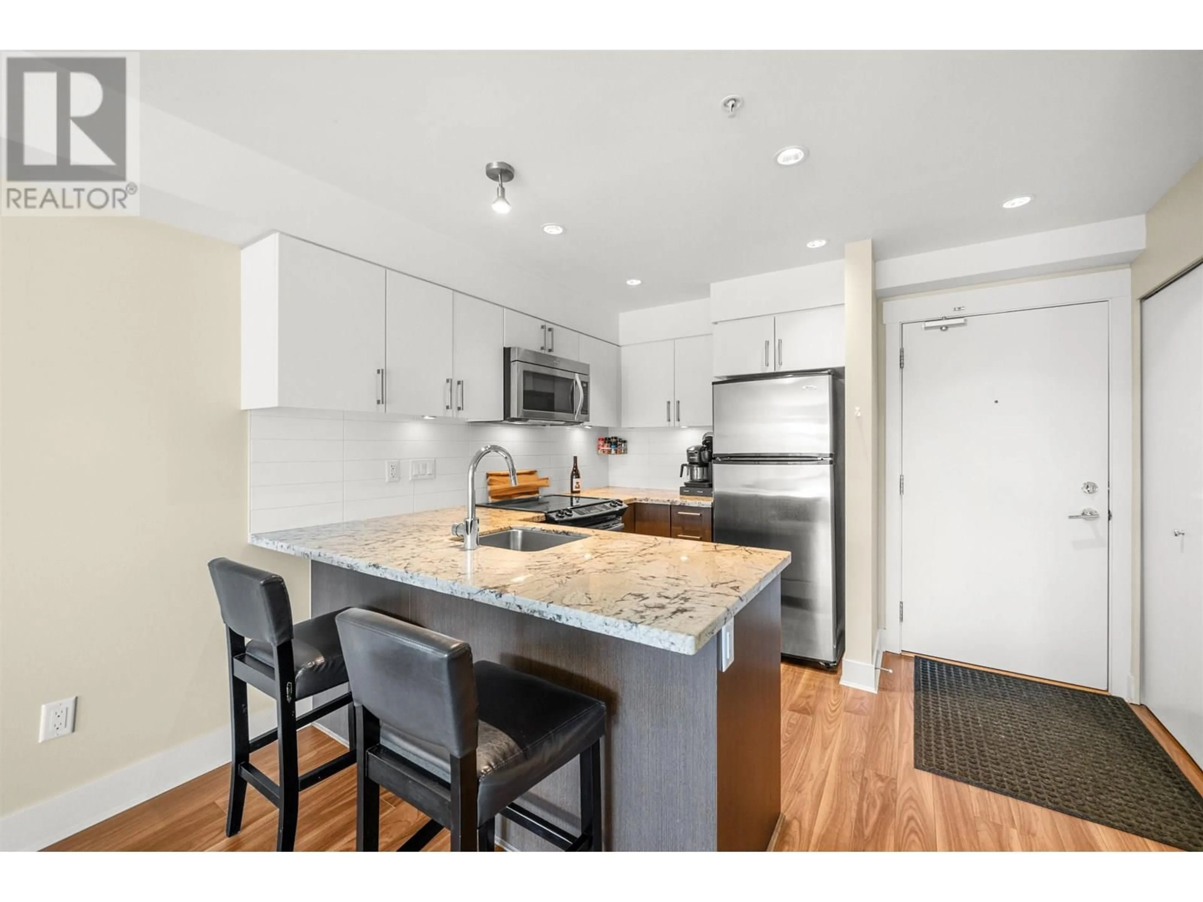 Open concept kitchen, wood/laminate floor for 319 - 85 EIGHTH AVENUE, New Westminster British Columbia V3L0E9
