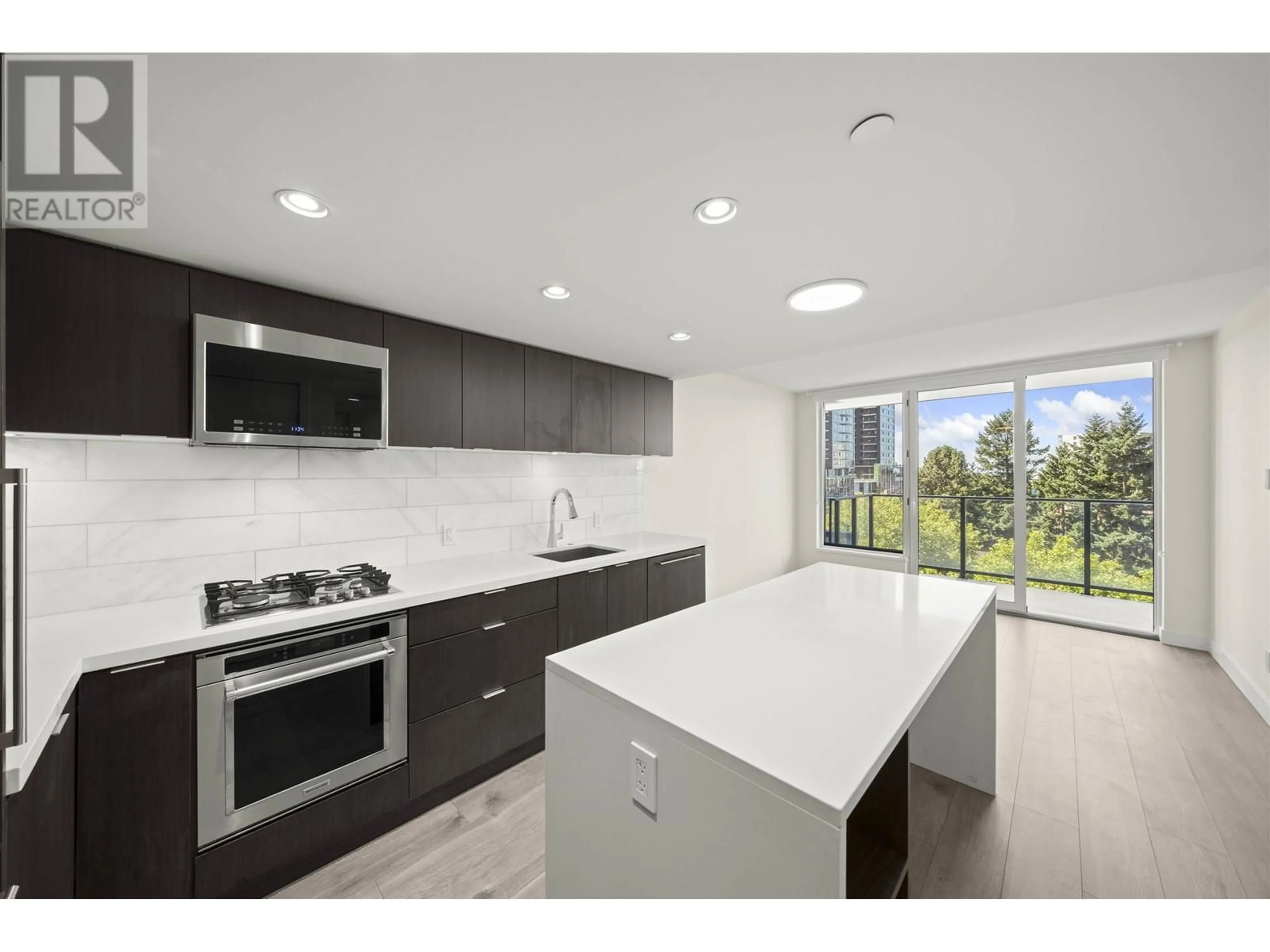 Open concept kitchen, ceramic/tile floor for 803 - 8238 LORD STREET, Vancouver British Columbia V6P0G7
