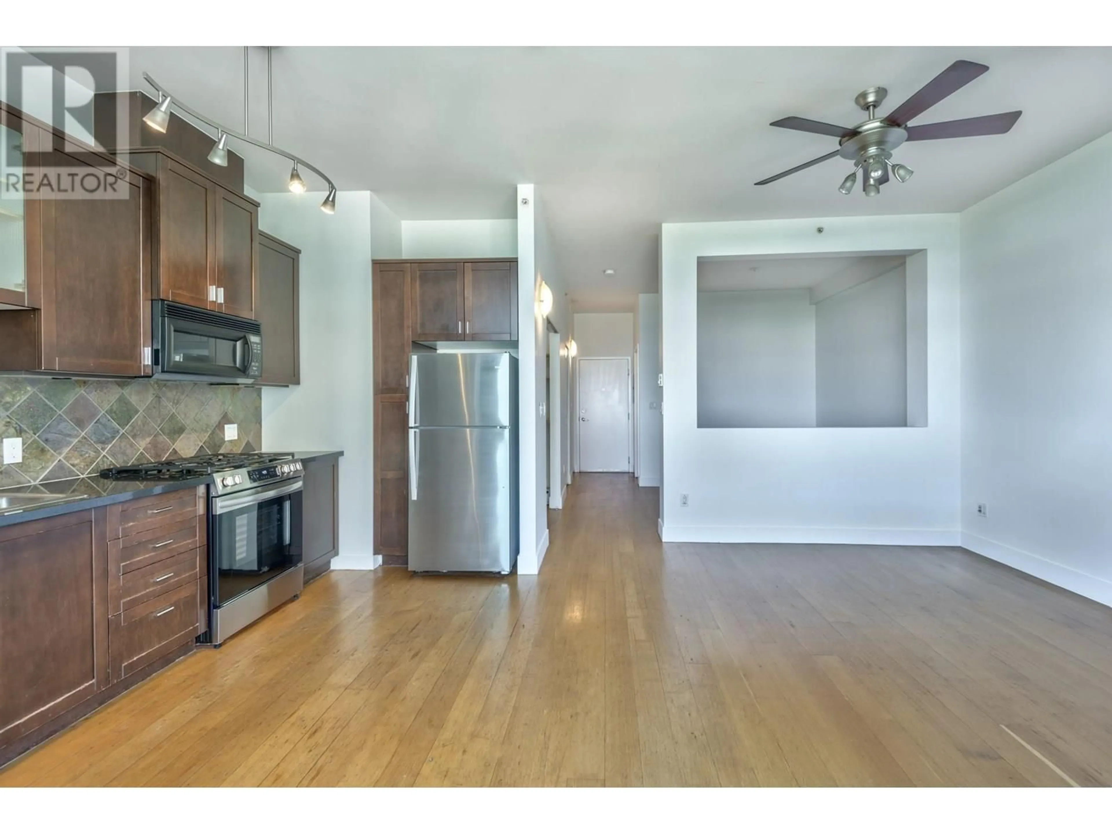 Open concept kitchen, wood/laminate floor for 413 - 8988 HUDSON STREET, Vancouver British Columbia V6P6Z1