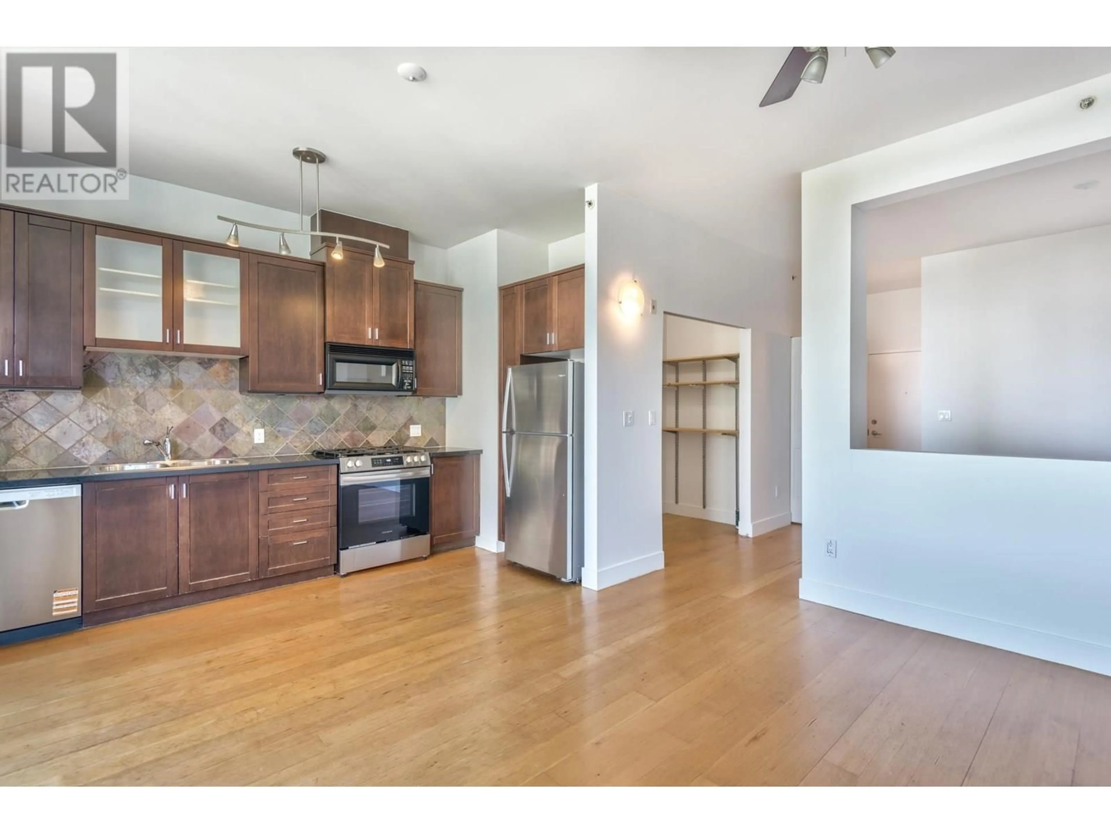 Open concept kitchen, wood/laminate floor for 413 - 8988 HUDSON STREET, Vancouver British Columbia V6P6Z1