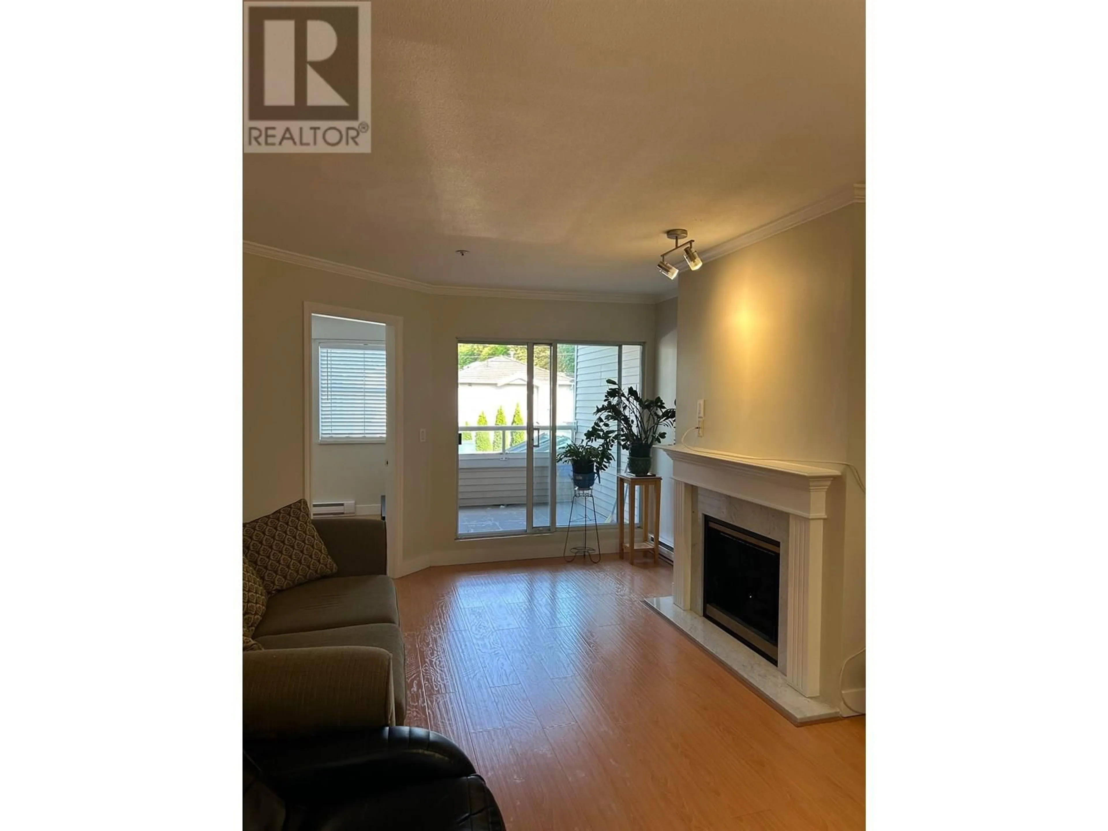 Living room with furniture, wood/laminate floor for 203 - 1958 47TH AVENUE, Vancouver British Columbia V5P3X5