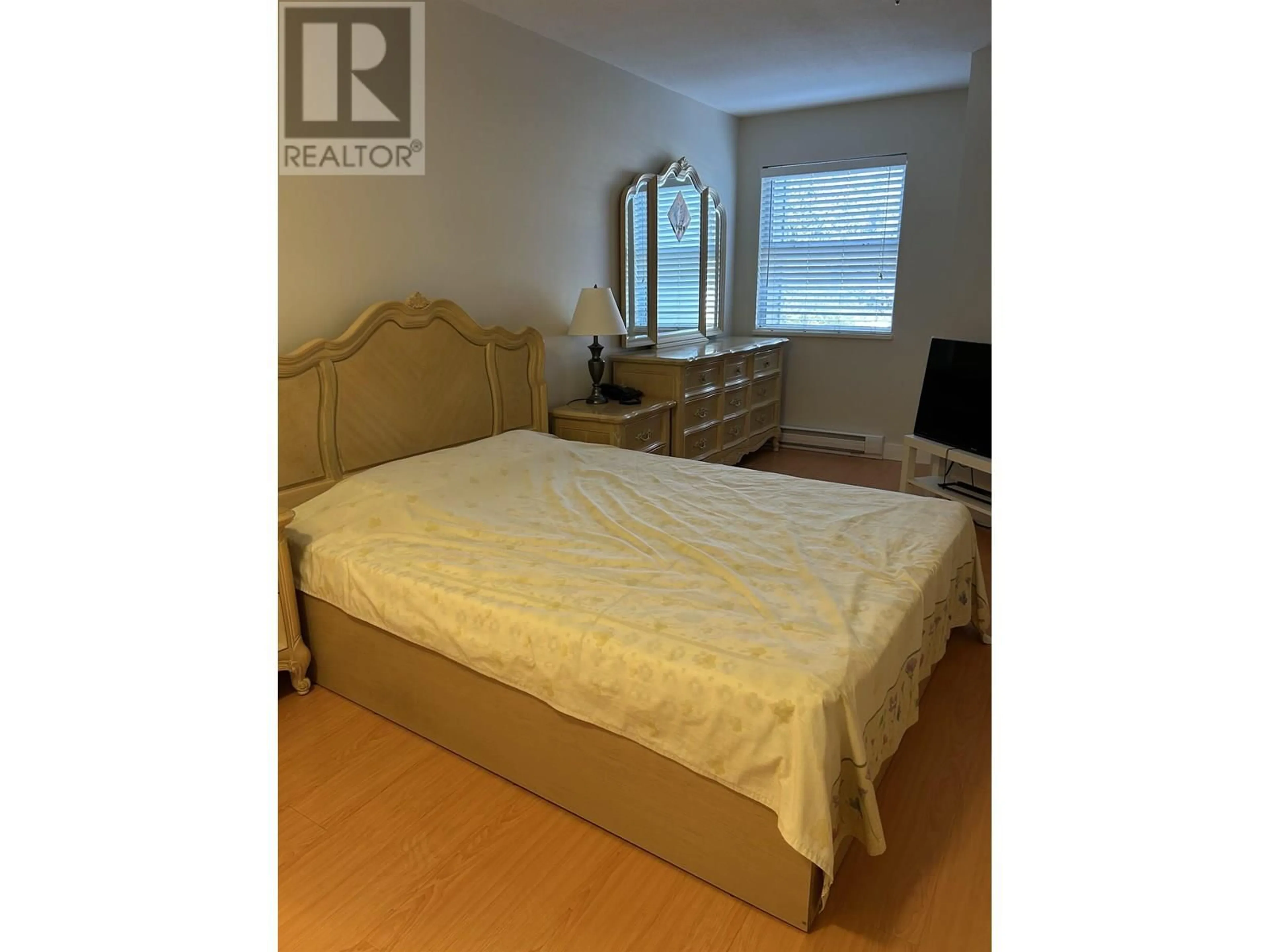 Bedroom with bed, wood/laminate floor for 203 - 1958 47TH AVENUE, Vancouver British Columbia V5P3X5