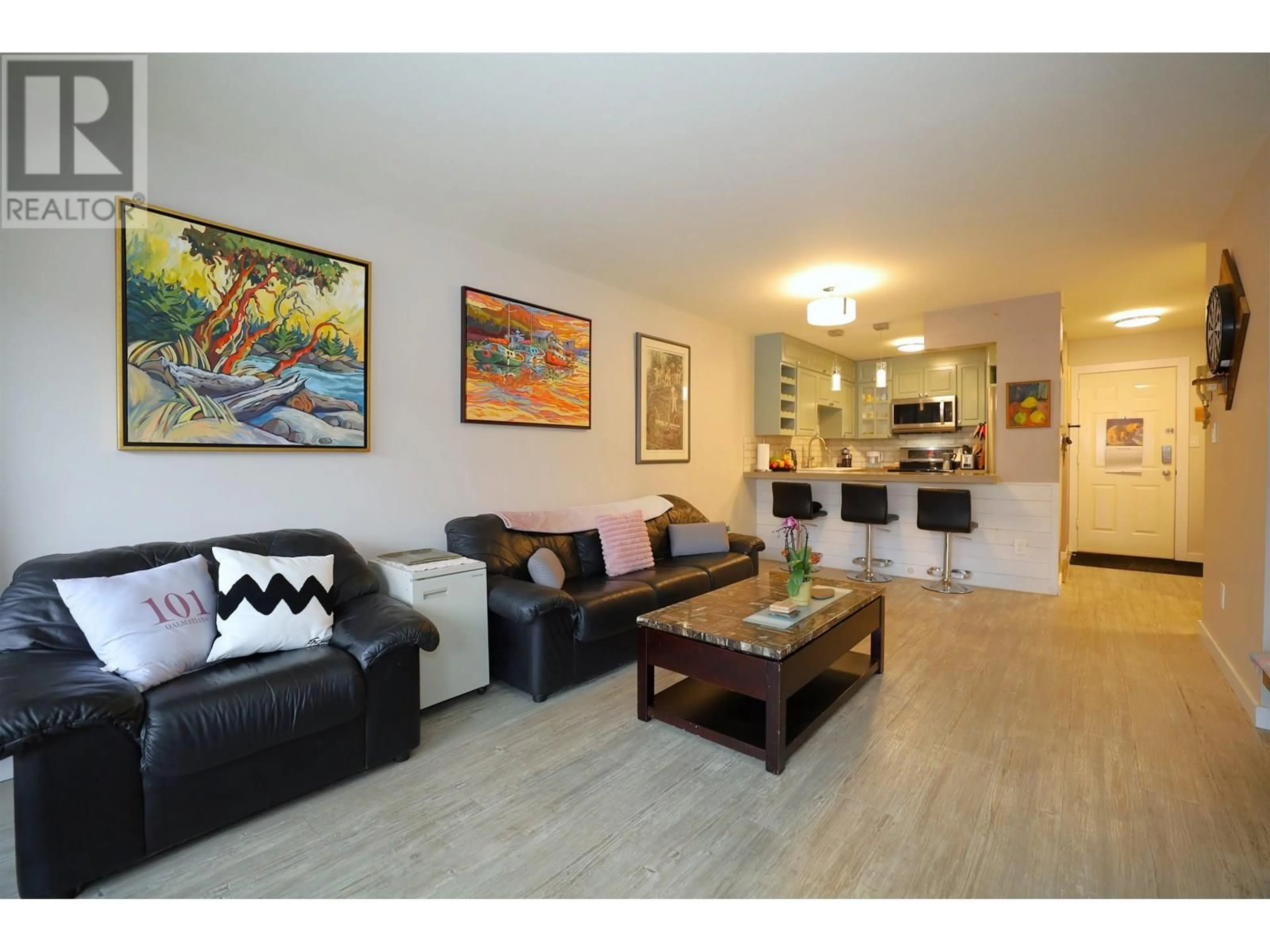Living room with furniture, wood/laminate floor for 202 - 703 GIBSONS WAY, Gibsons British Columbia V0N1V9
