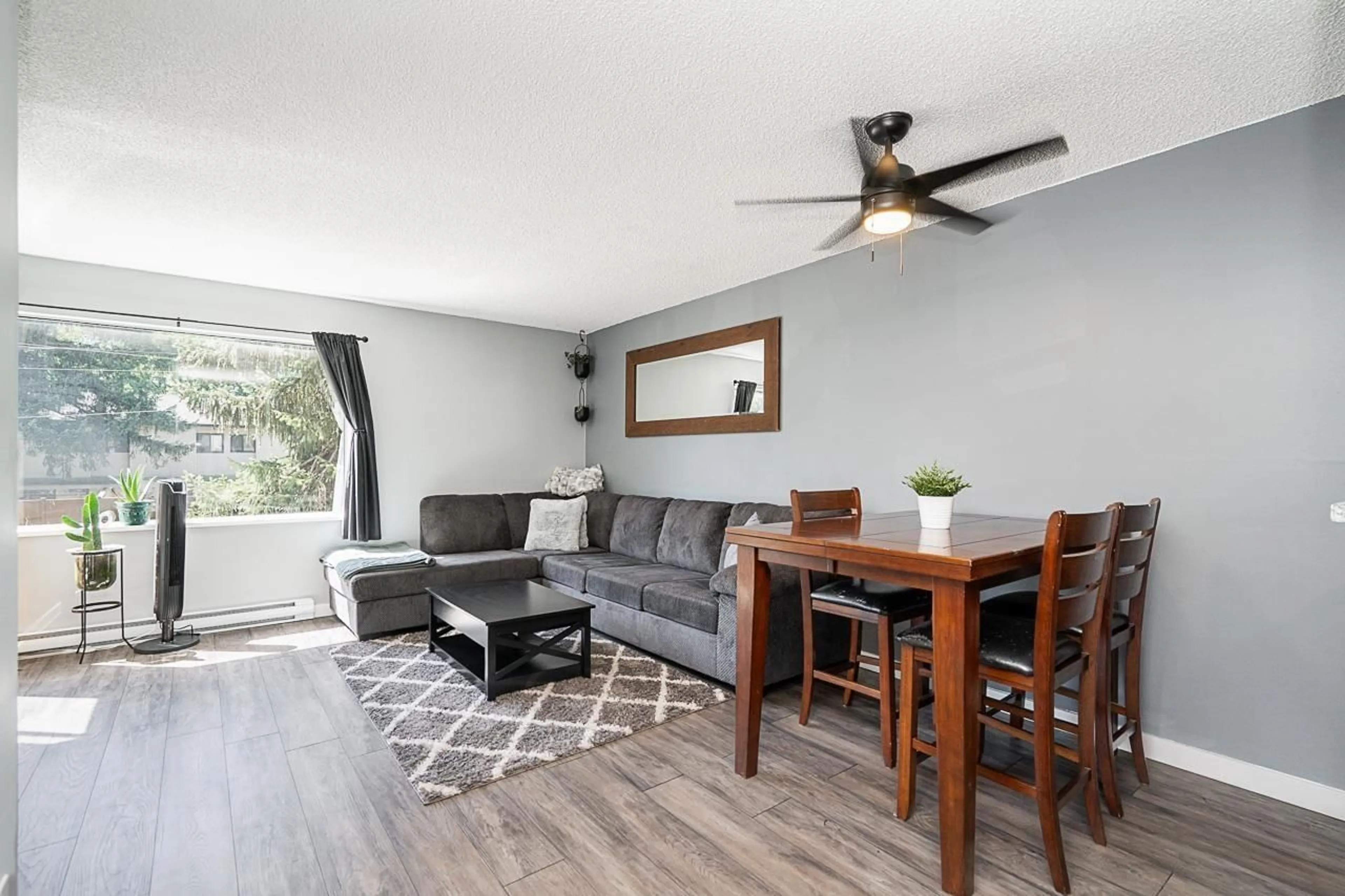 Living room with furniture, wood/laminate floor for 112 - 5294 204TH, Langley British Columbia V3A1Z1