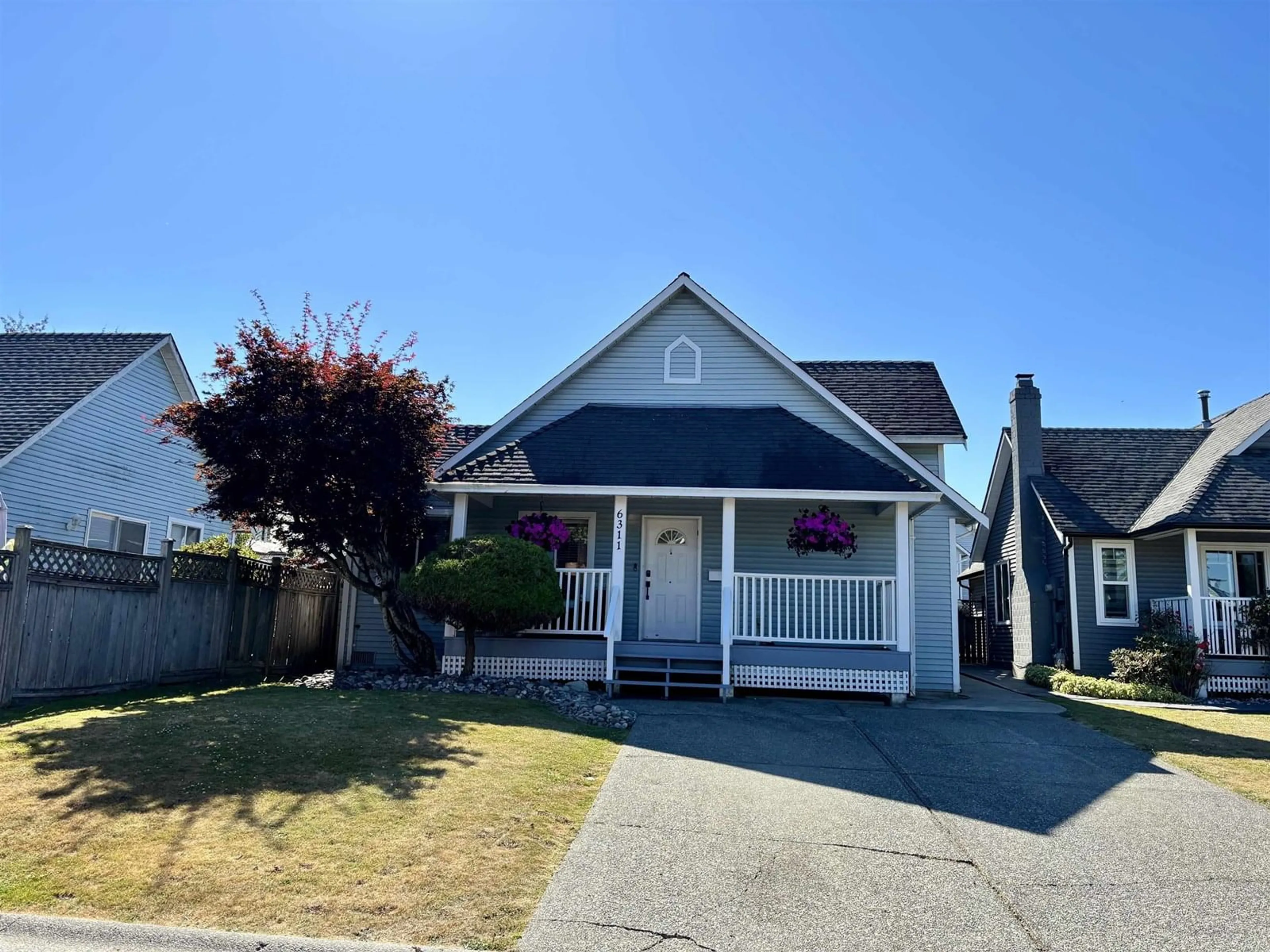 Home with vinyl exterior material, street for 6311 135A, Surrey British Columbia V3X1J7