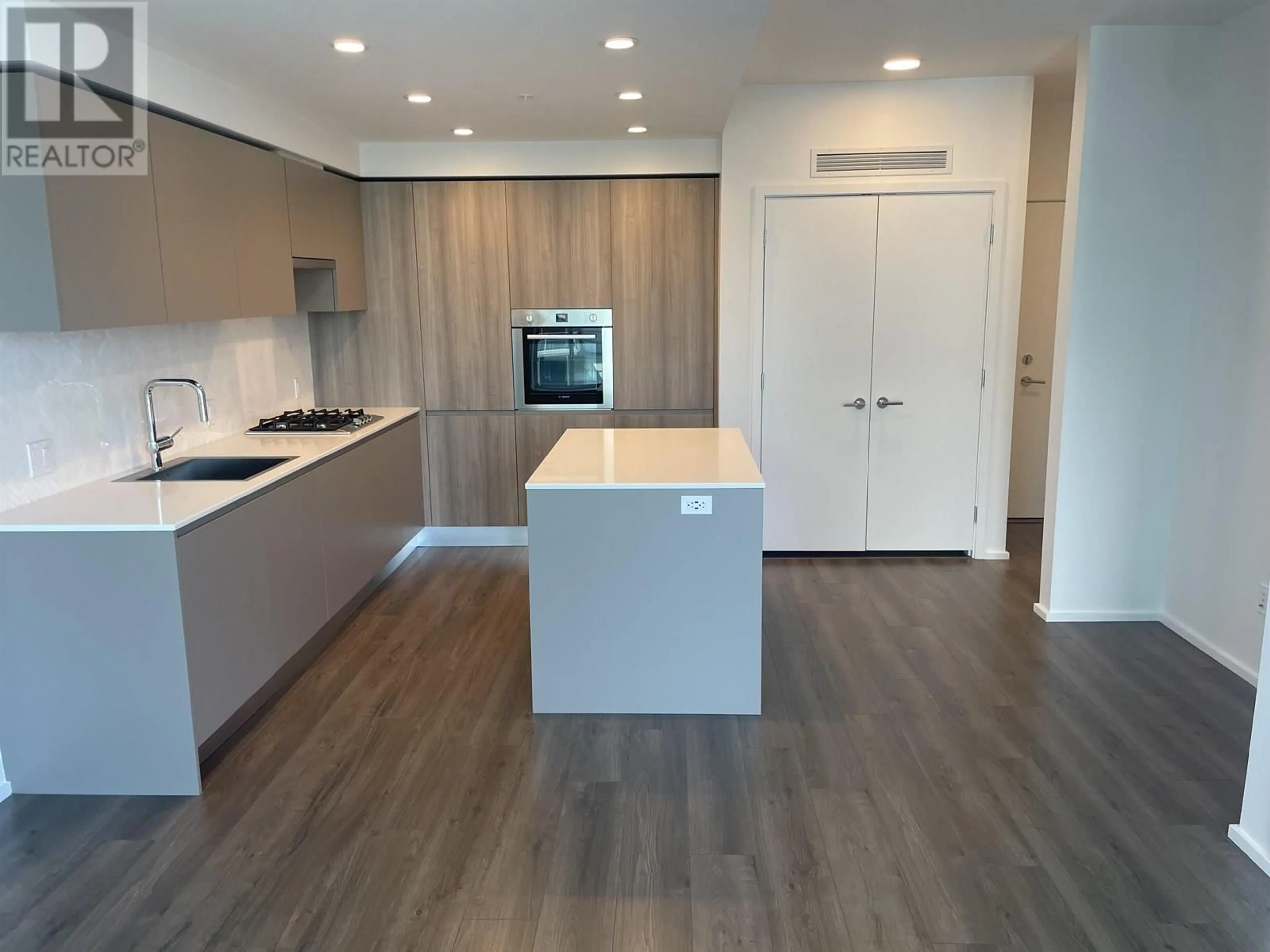 Open concept kitchen, wood/laminate floor for 3504 - 3833 EVERGREEN PLACE, Burnaby British Columbia V3J0M2
