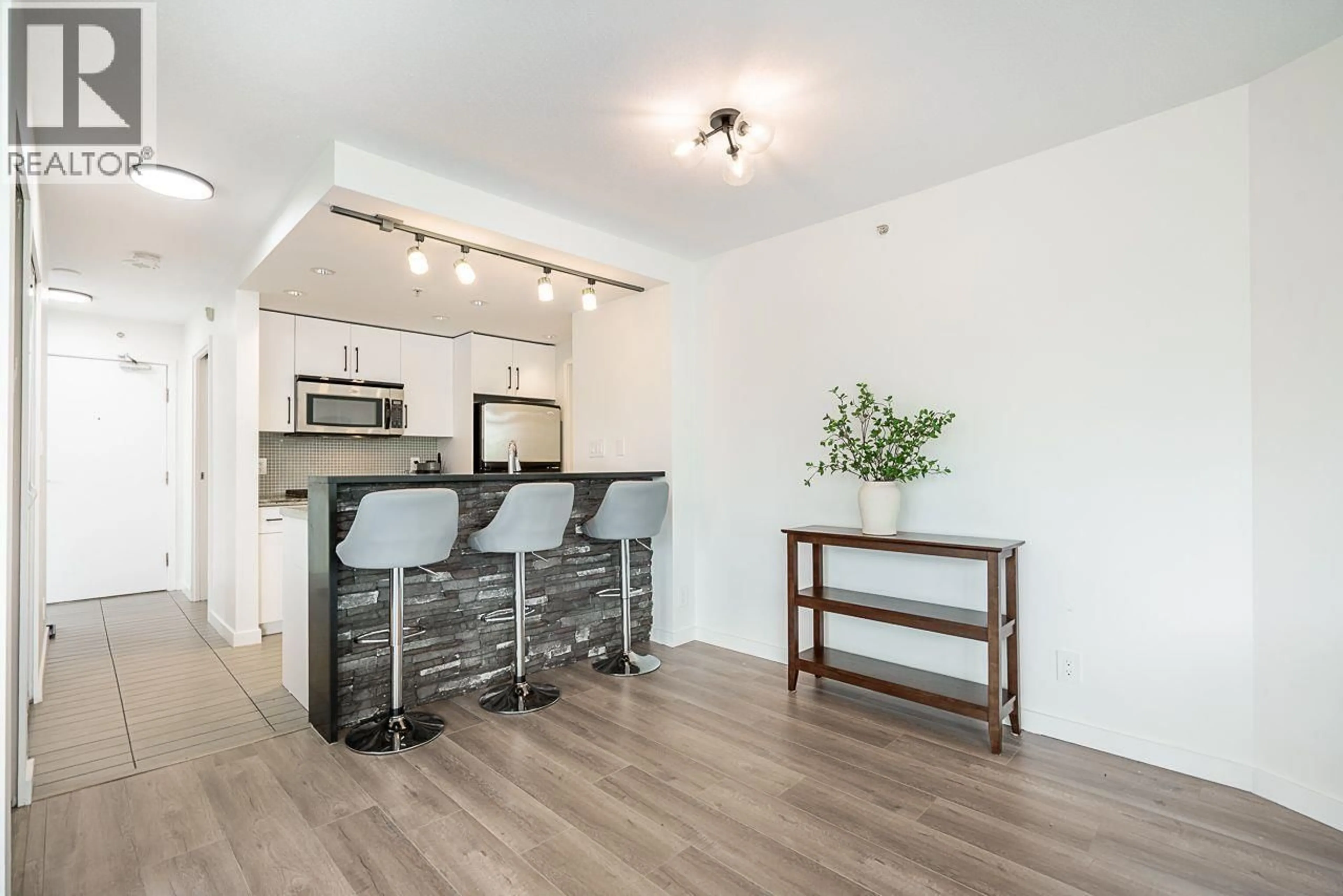 Open concept kitchen, wood/laminate floor for 603 - 980 COOPERAGE WAY, Vancouver British Columbia V6B0C3