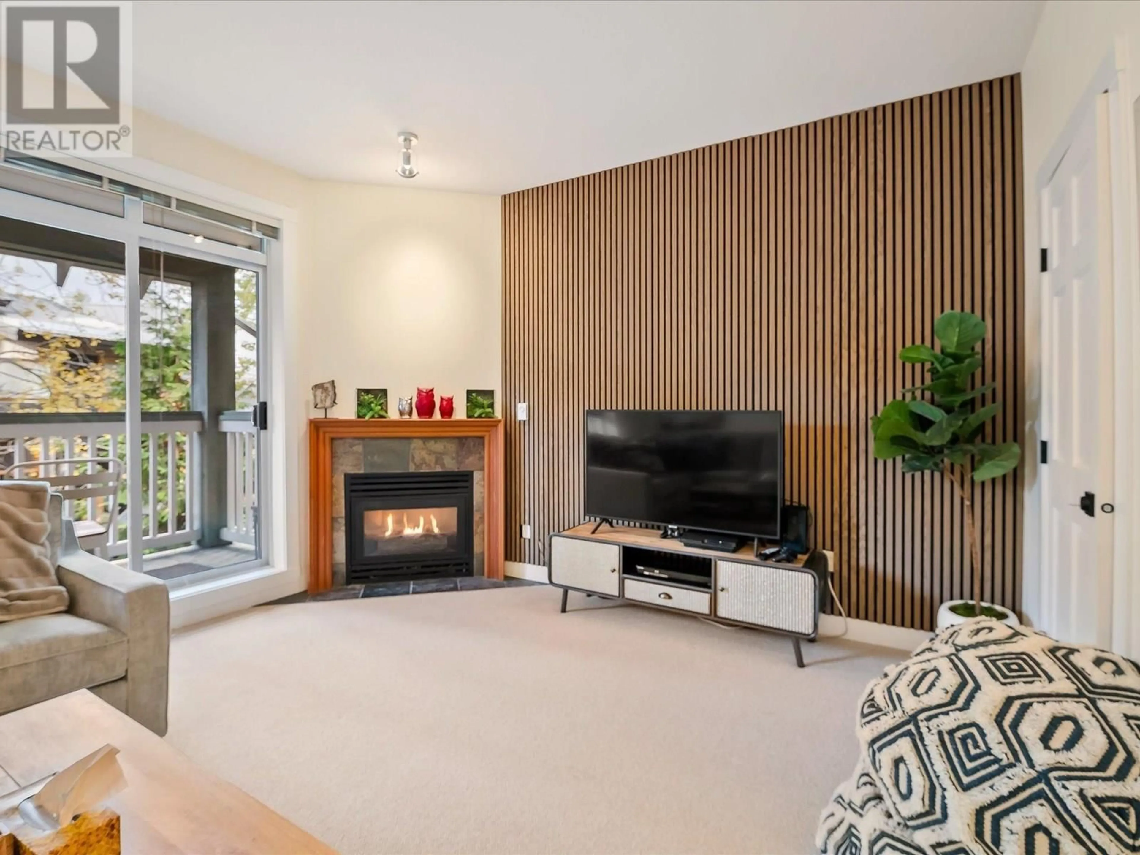 Living room with furniture, unknown for 203 - 4405 BLACKCOMB WAY, Whistler British Columbia V8E0X7