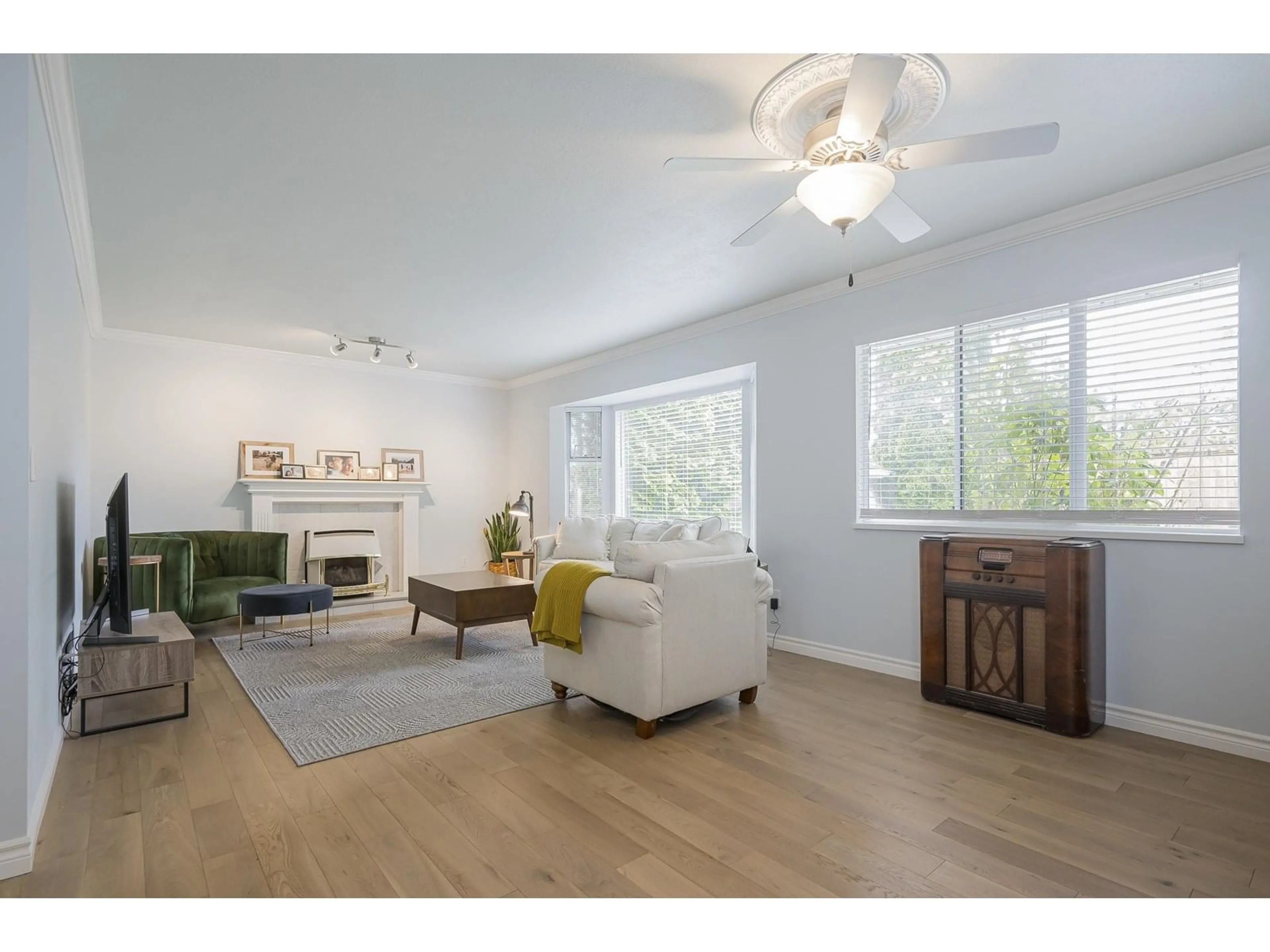 Living room with furniture, wood/laminate floor for 27236 32B AVENUE, Langley British Columbia V4W3H8