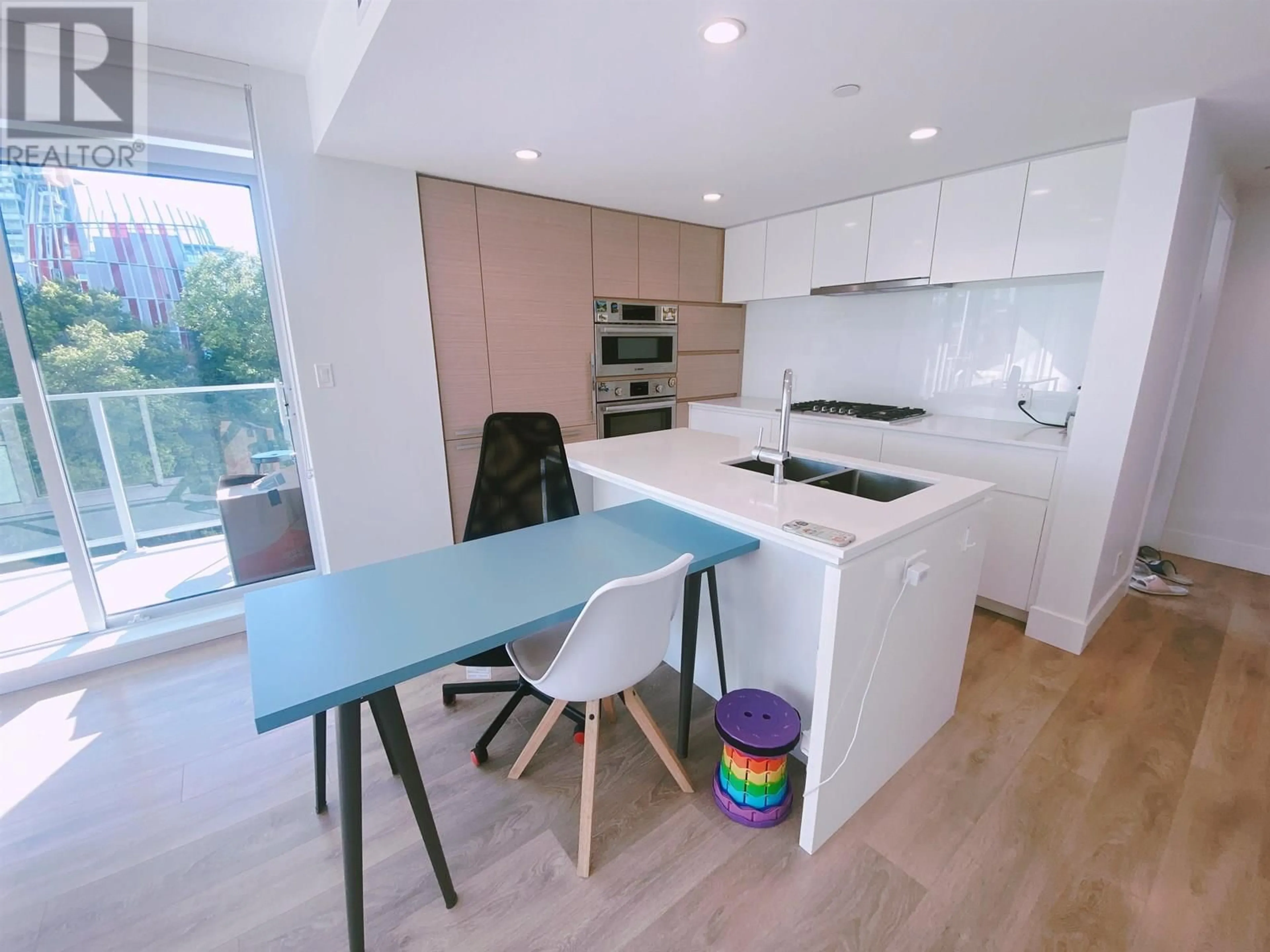 Open concept kitchen, wood/laminate floor for 403 - 5508 HOLLYBRIDGE WAY, Richmond British Columbia V7C0C7