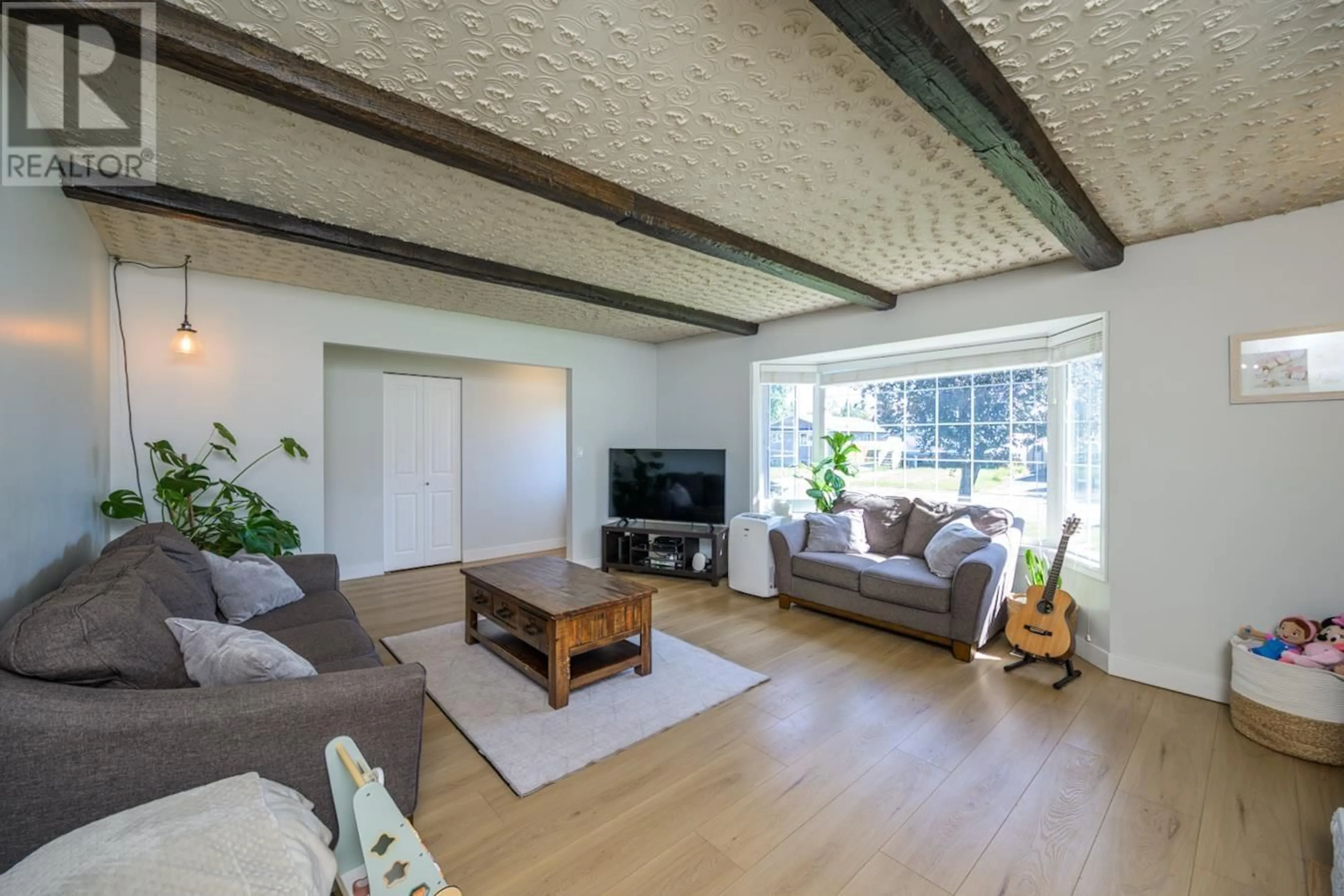 Living room with furniture, wood/laminate floor for 4541 VALLEY CRESCENT, Prince George British Columbia V2M5L8