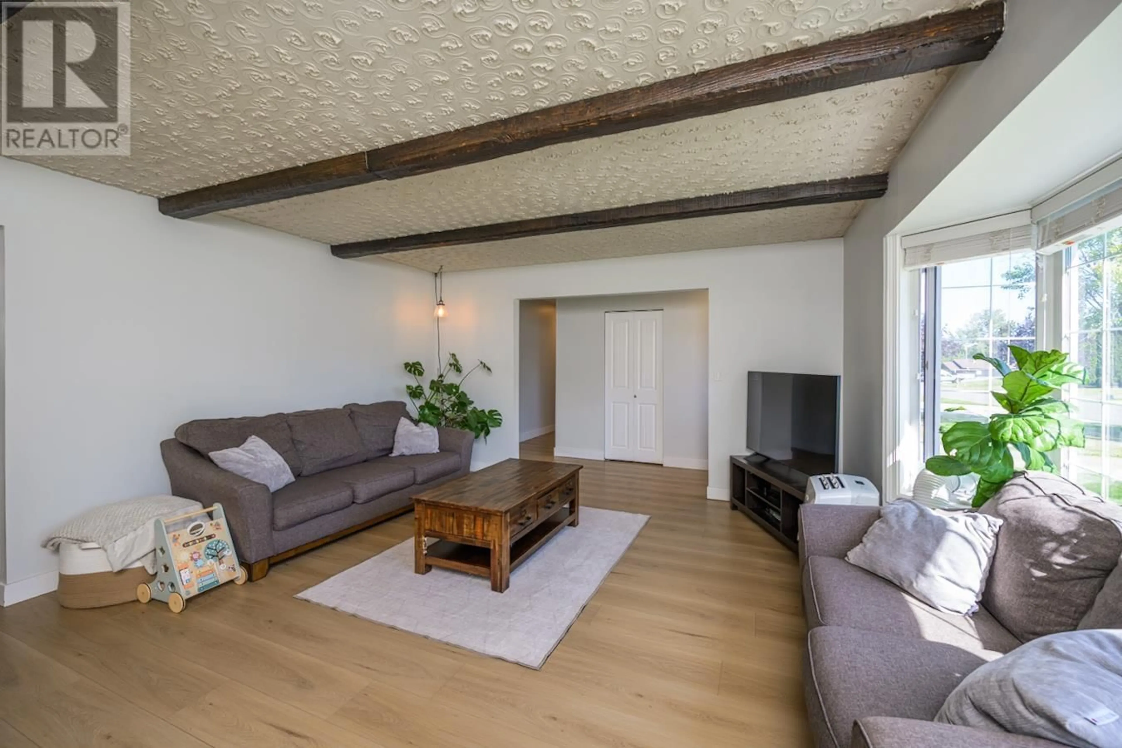 Living room with furniture, wood/laminate floor for 4541 VALLEY CRESCENT, Prince George British Columbia V2M5L8