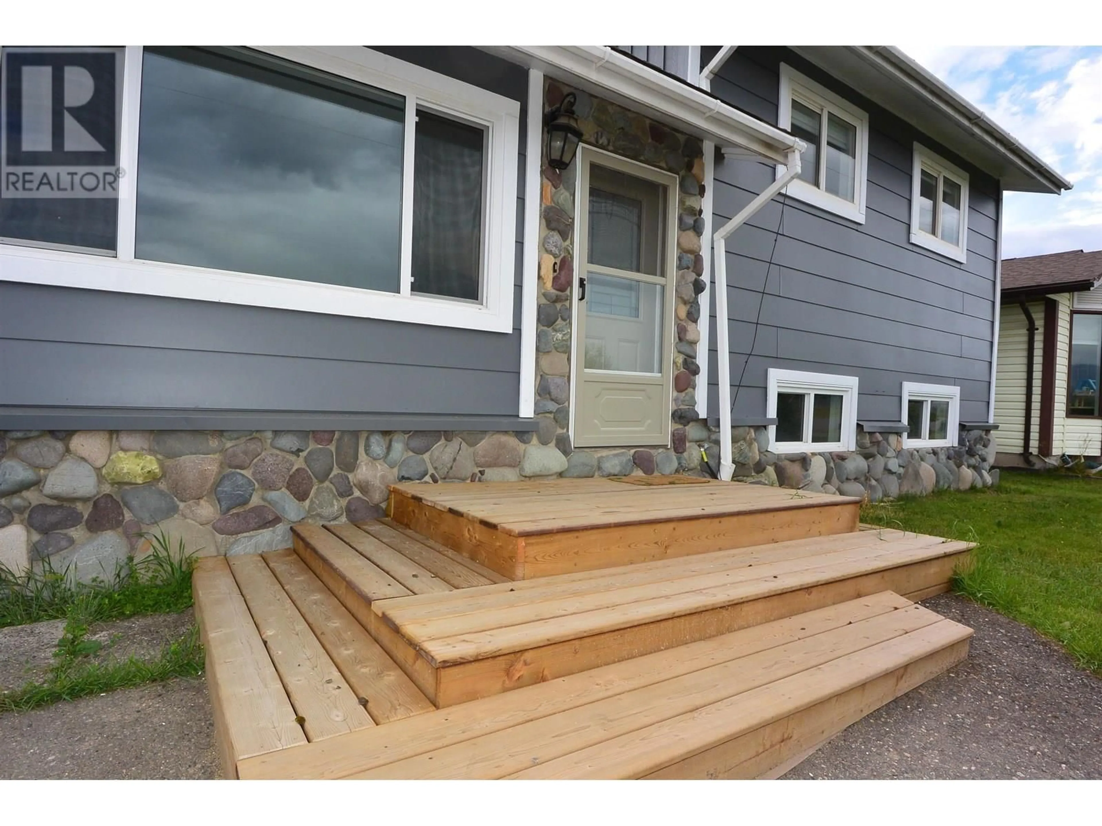 Home with vinyl exterior material, street for 4055 ALFRED AVENUE, Smithers British Columbia V0J2N0
