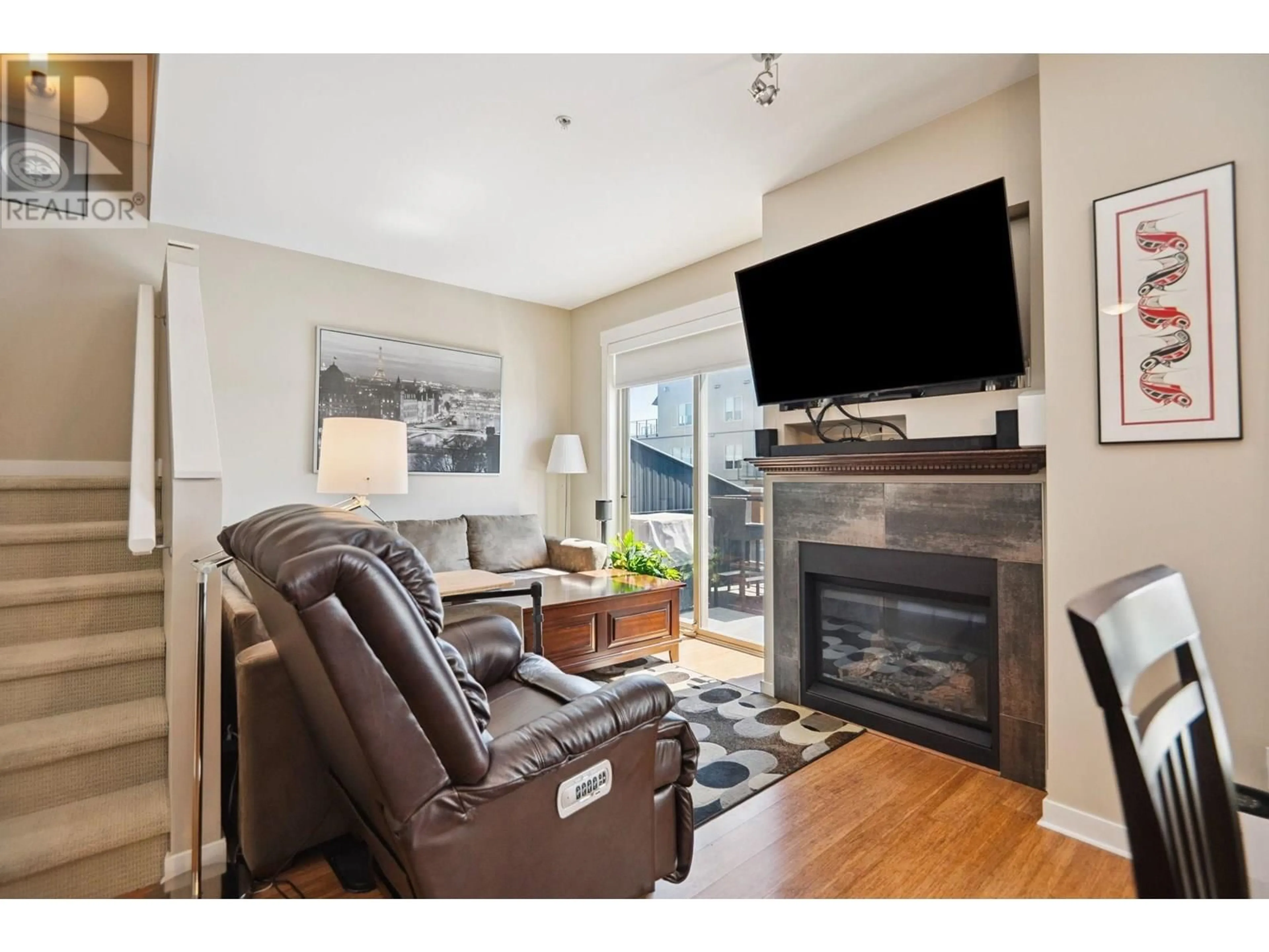 Living room with furniture, wood/laminate floor for 303 - 6077 LONDON ROAD, Richmond British Columbia V7E0A7