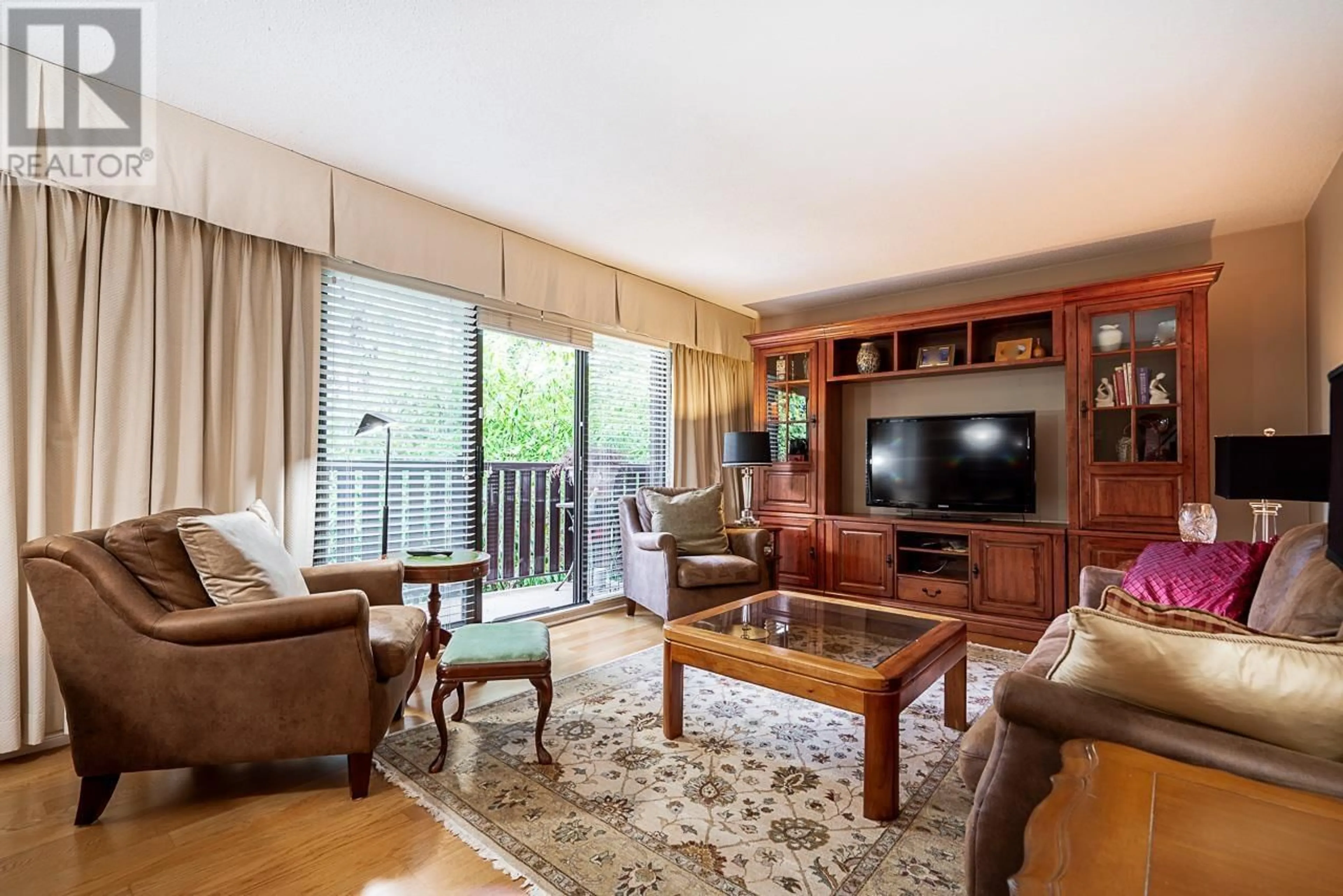 Living room with furniture, wood/laminate floor for 211 - 175 4TH STREET, North Vancouver British Columbia V7L1H8