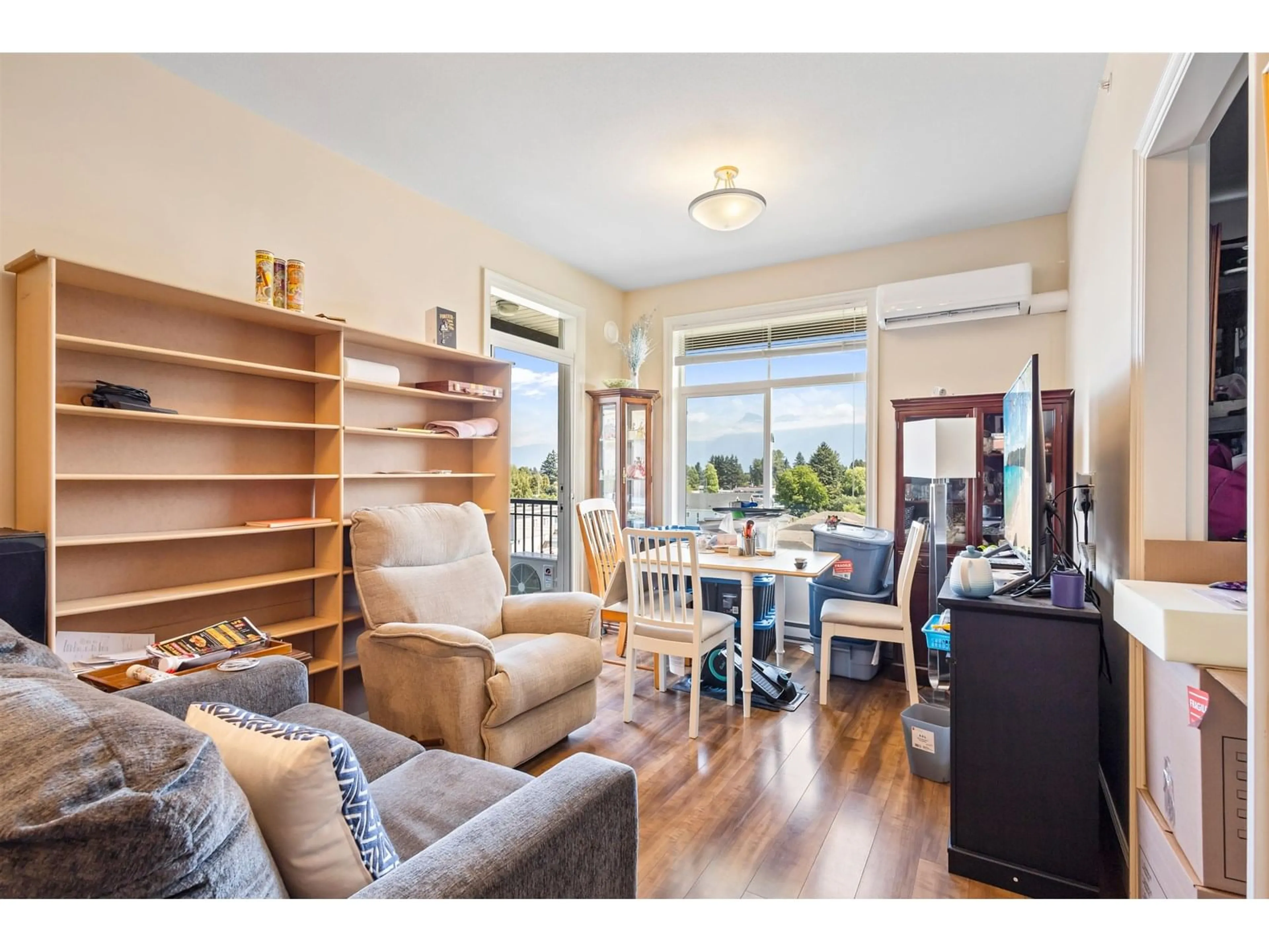 Living room with furniture, wood/laminate floor for 417 - 8531 YOUNG ROAD, Chilliwack British Columbia V2P0E1