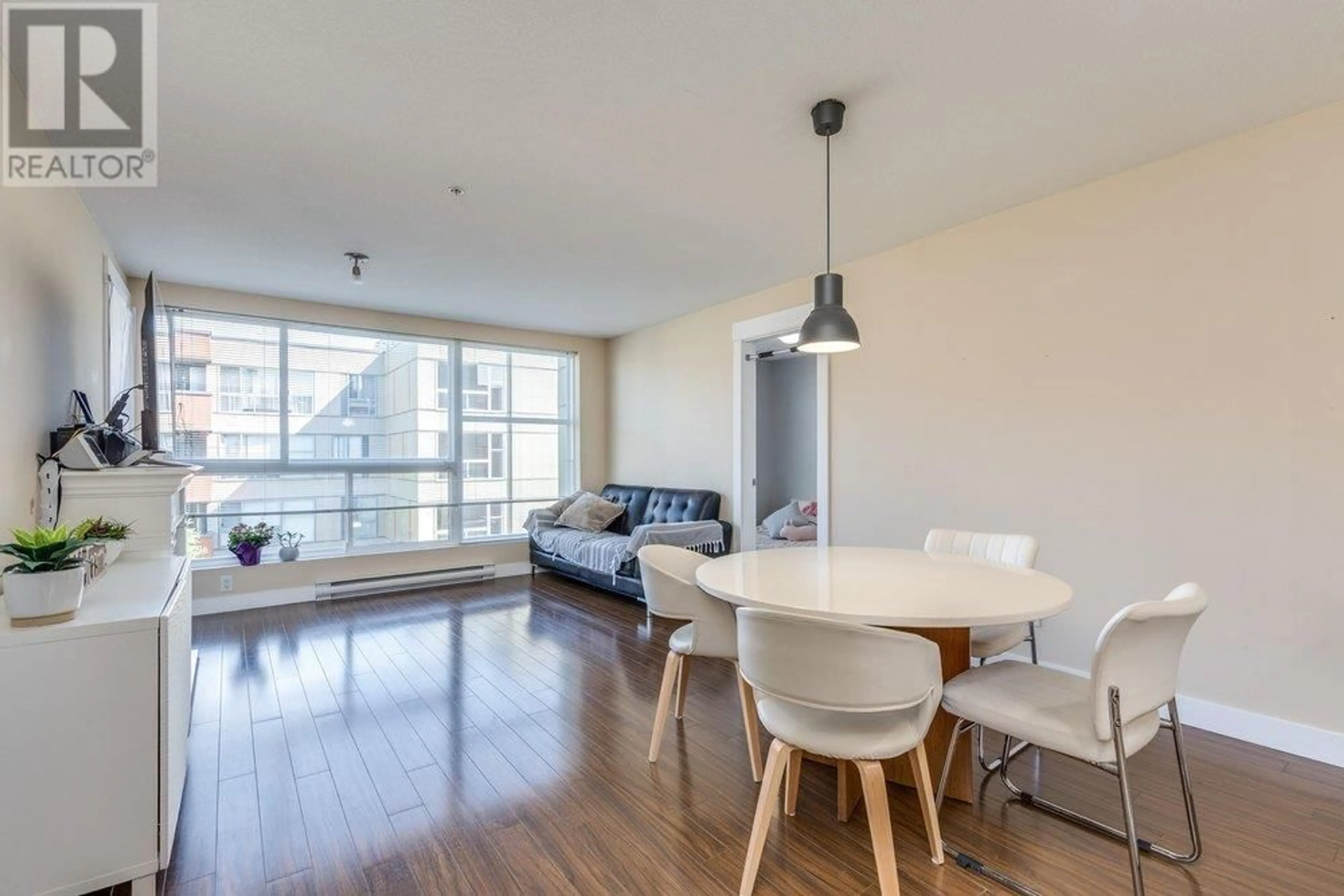 Living room with furniture, wood/laminate floor for 313 - 12075 228 STREET, Maple Ridge British Columbia V2X6M2