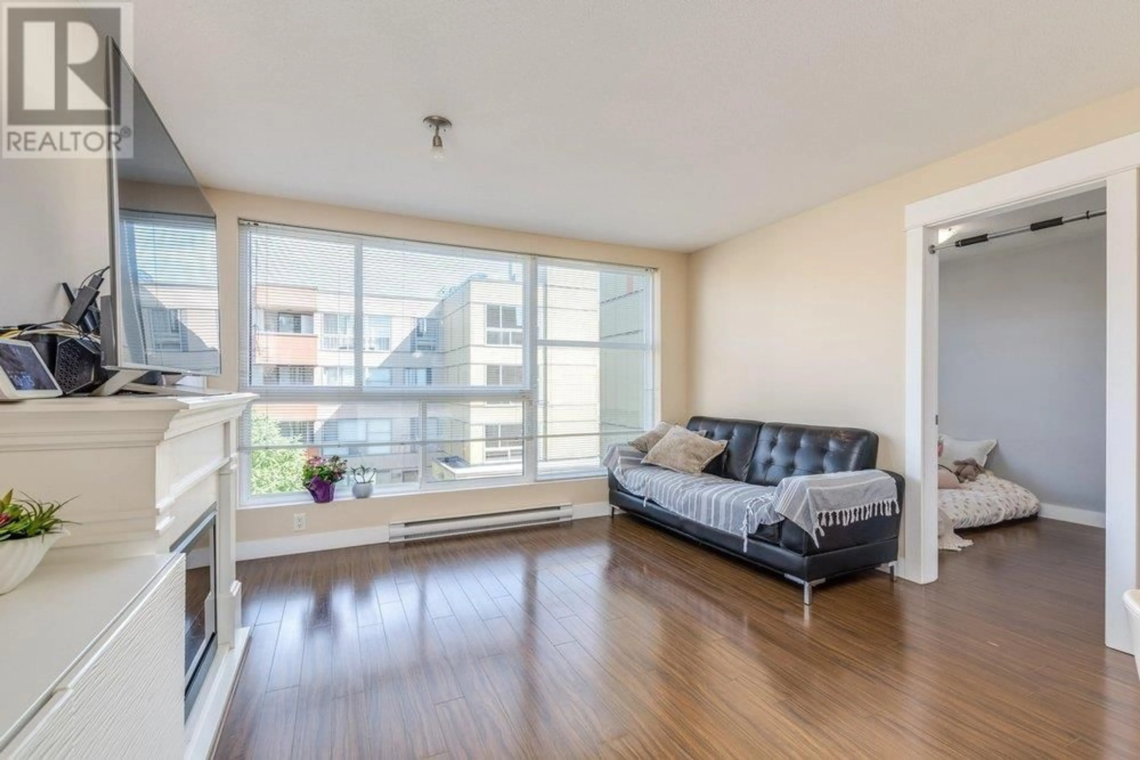 Living room with furniture, wood/laminate floor for 313 - 12075 228 STREET, Maple Ridge British Columbia V2X6M2
