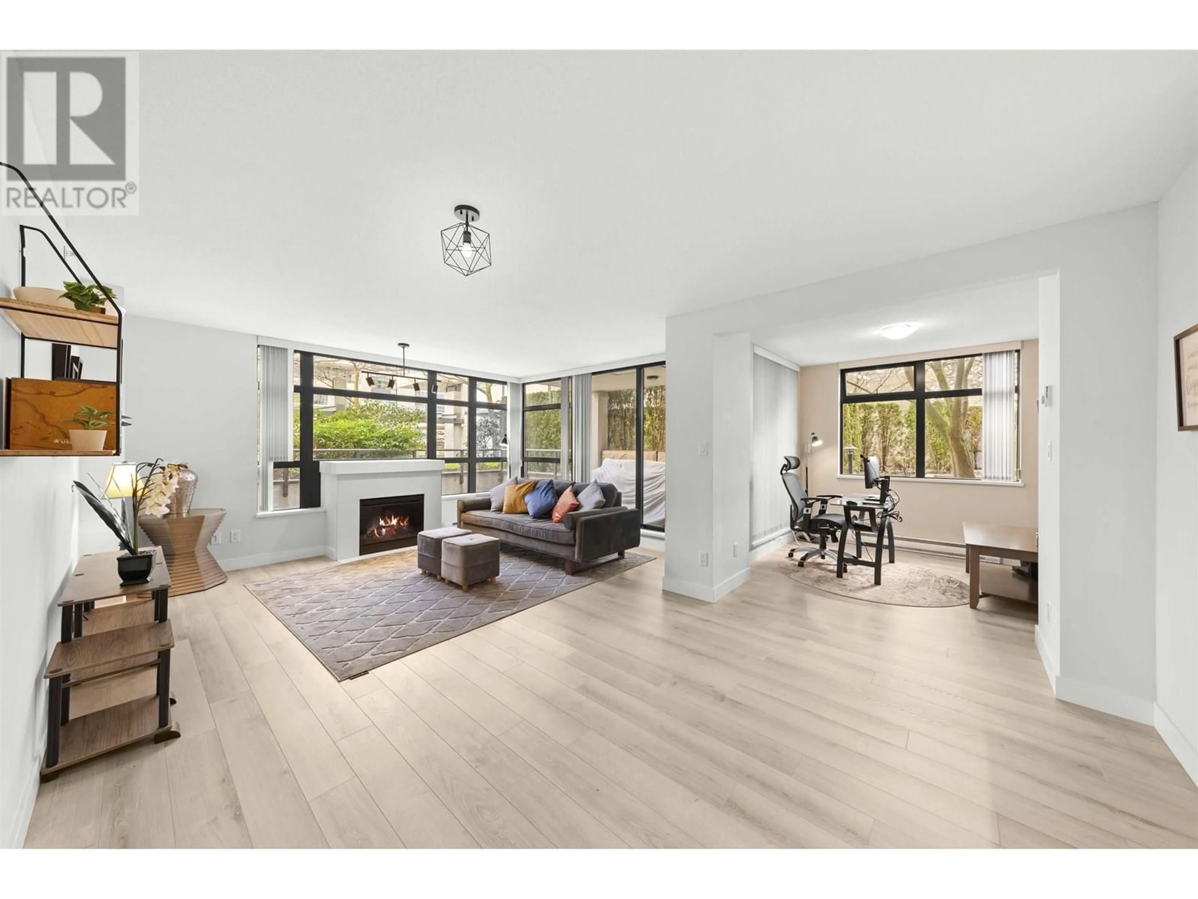Living room with furniture, wood/laminate floor for 303 - 8180 LANSDOWNE ROAD, Richmond British Columbia V6X0B1