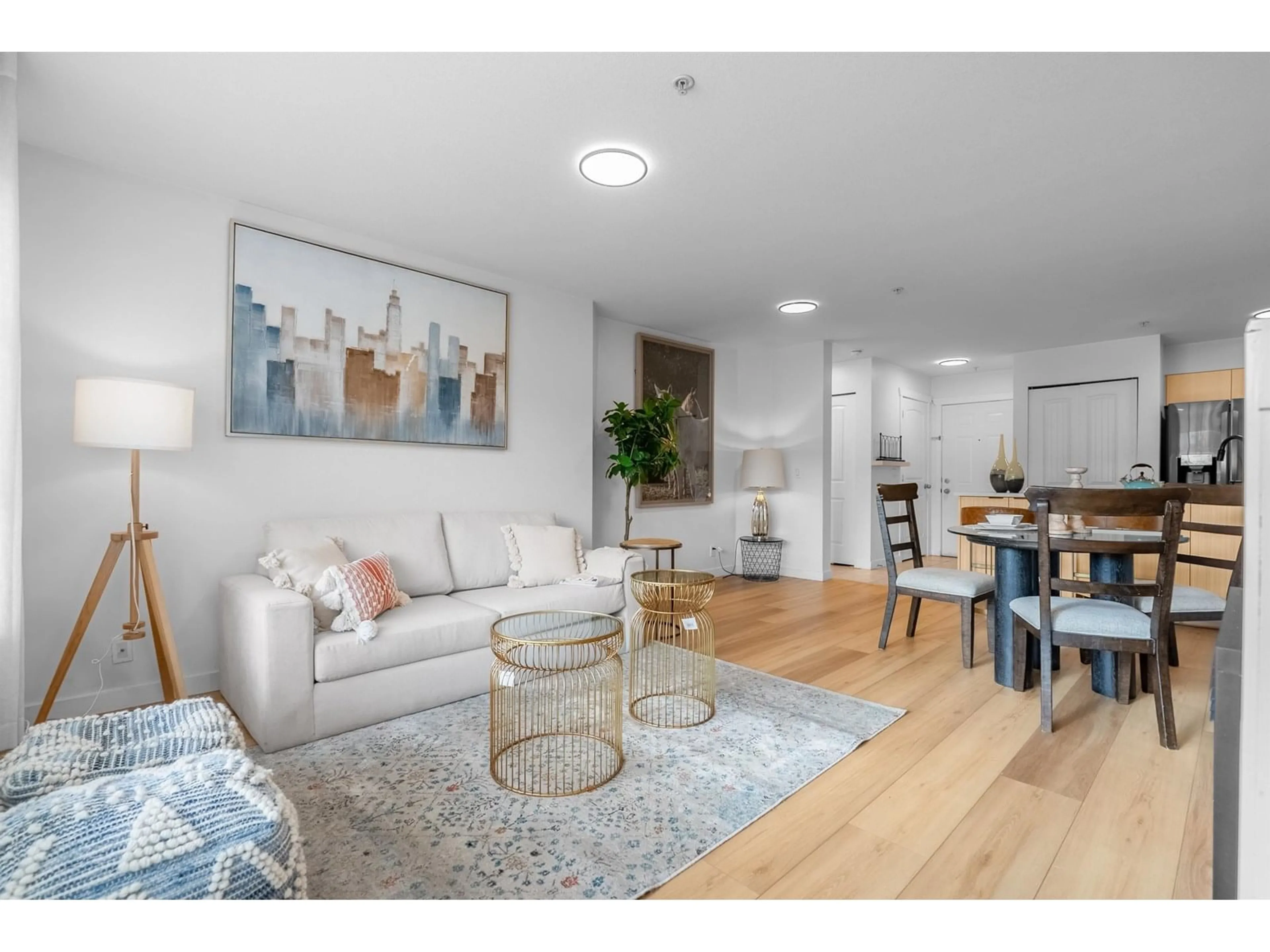 Living room with furniture, wood/laminate floor for 314 - 6960 120, Surrey British Columbia V3W1V4